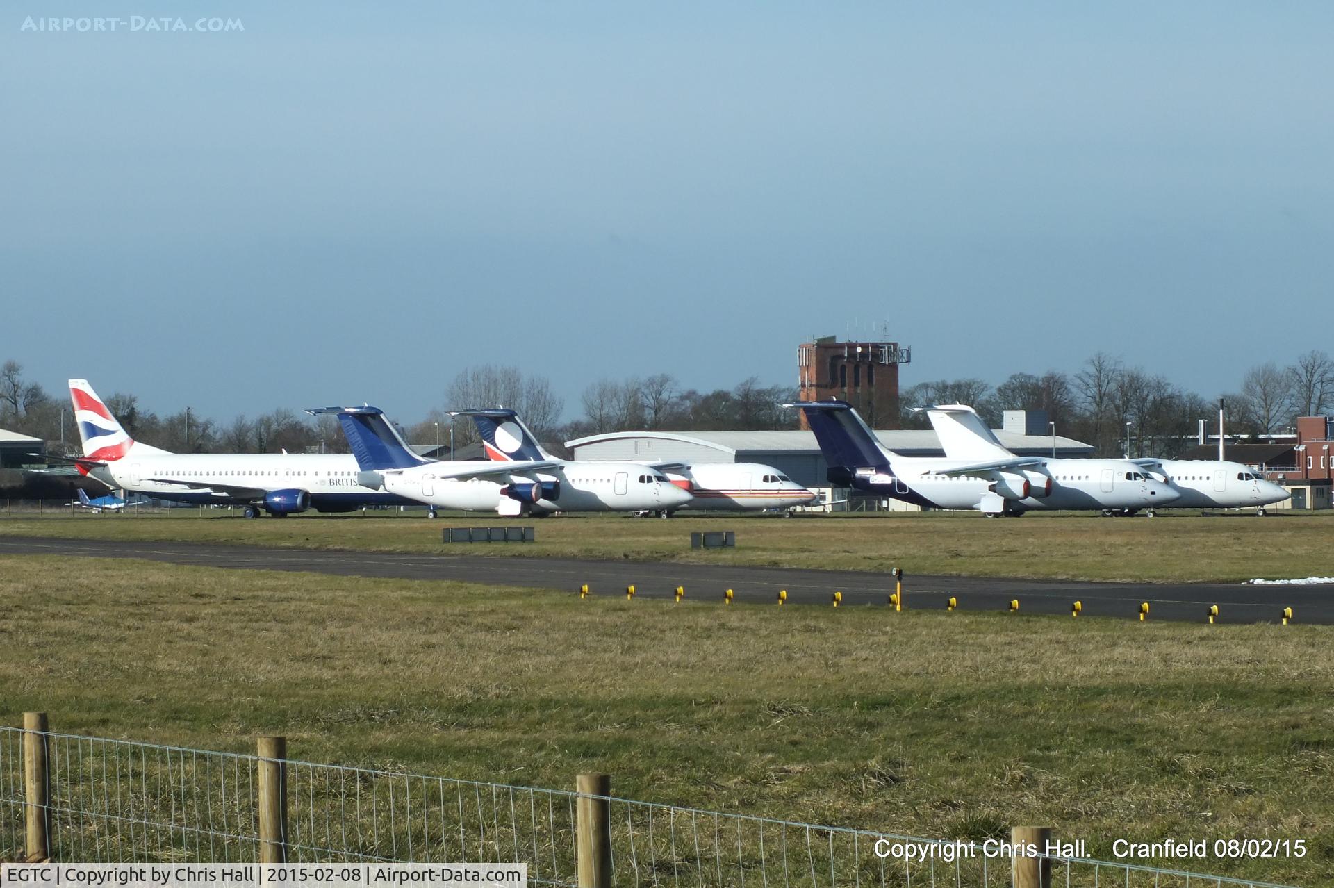Cranfield Airport, Cranfield, England United Kingdom (EGTC) - four BAe 146's and a B737 in storage at Cranfield