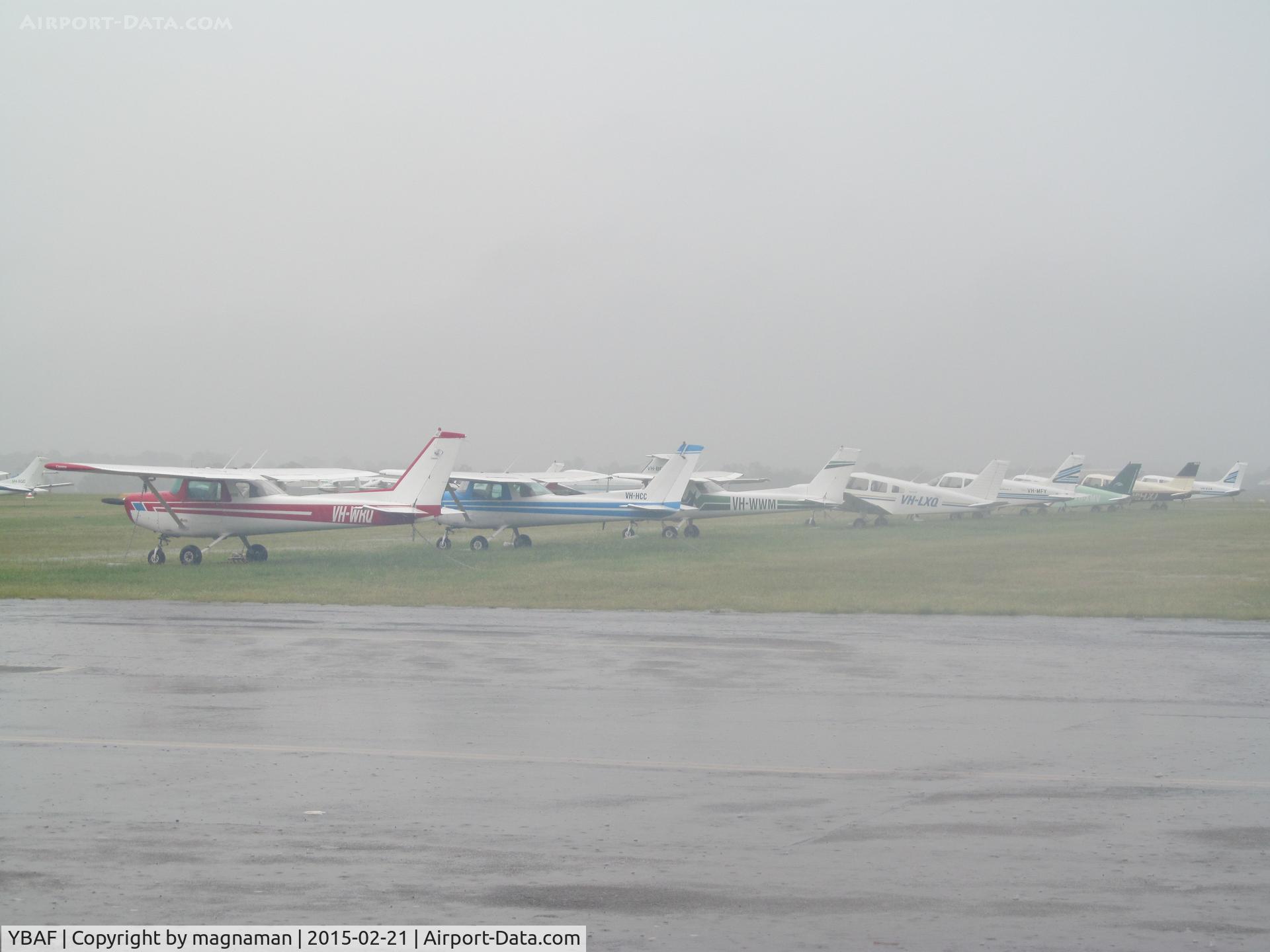 Archerfield Airport, Archerfield, Queensland Australia (YBAF) - In the torrential rain of a tropical storm - flying club ramp
