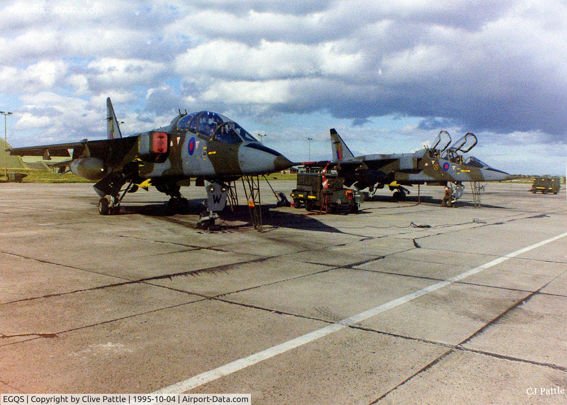 RAF Lossiemouth Airport, Lossiemouth, Scotland United Kingdom (EGQS) - 16 (R) Sqn ramp at RAF Lossiemouth EGQS in October 1995 showing two of the Sqn's Sepecat Jaguar T.2's awaiting their next training sortie.