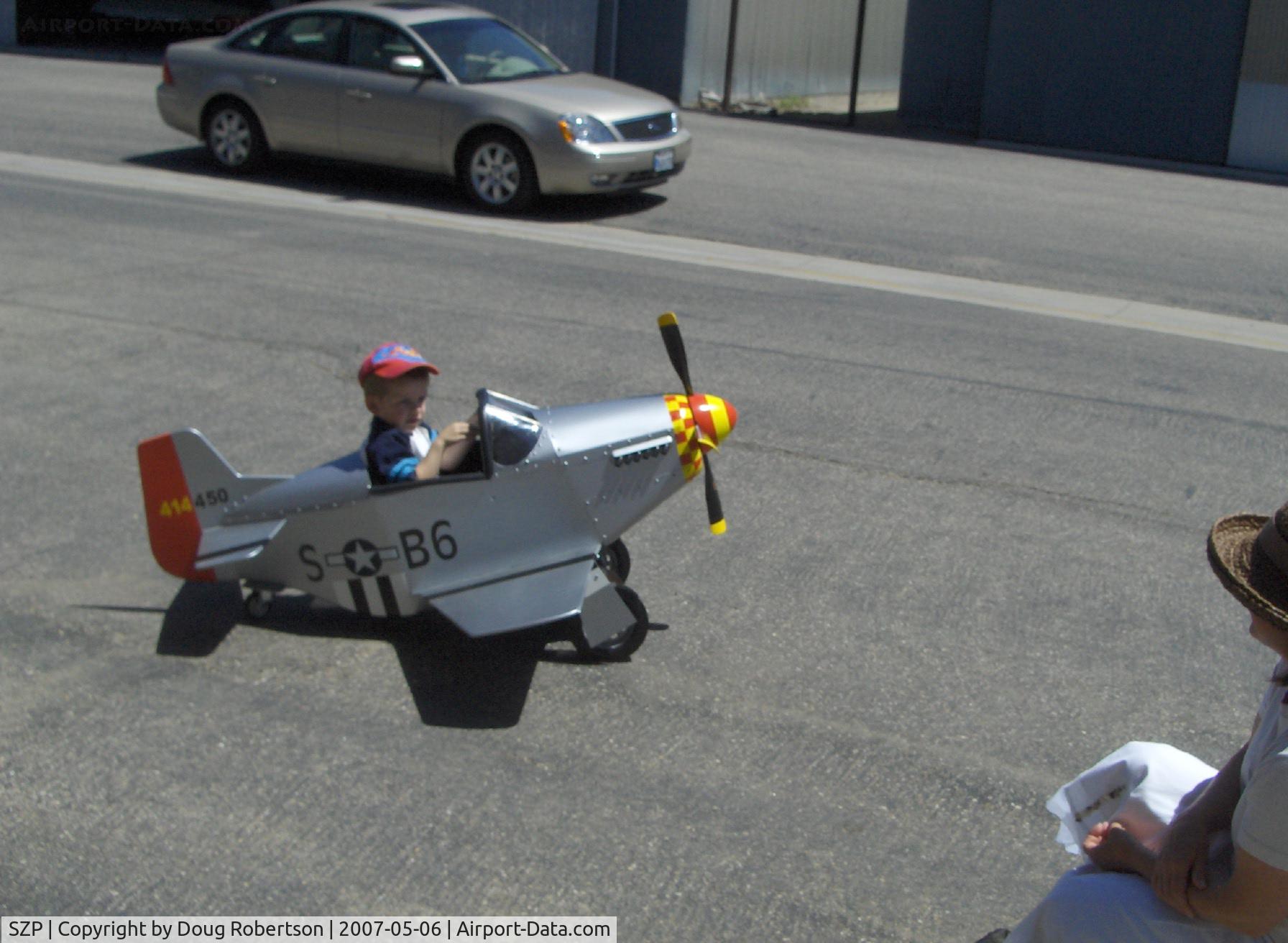 Santa Paula Airport (SZP) - P-51 MUSTANG Pedal Plane-3-4 year old power, approved for solo flight only, slow S turns taxi to Rwy 04, plans-built by Dad