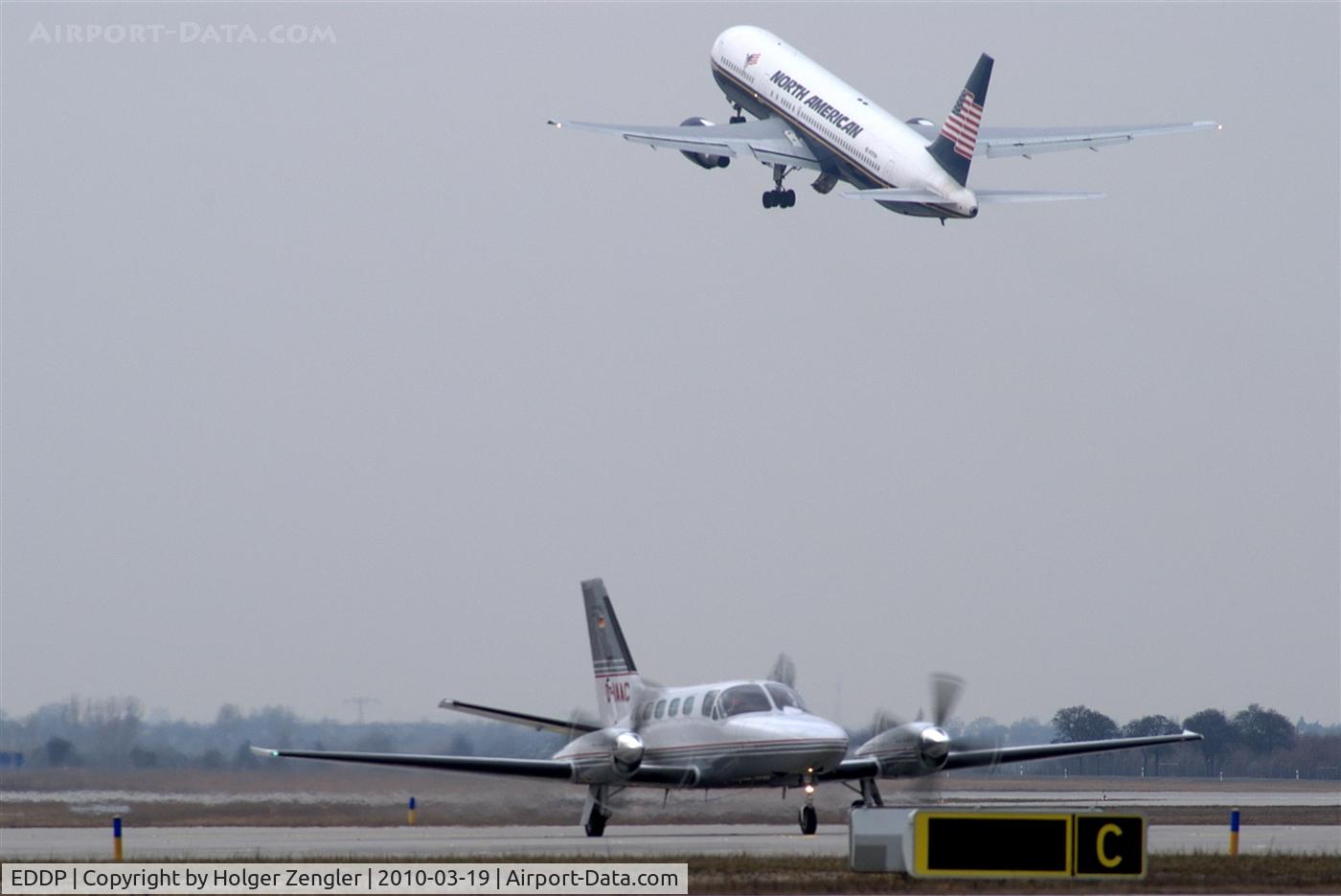 Leipzig/Halle Airport, Leipzig/Halle Germany (EDDP) - Outbound MAC traffic leaves rwy 26R meanwhile business traffic comes along twy Charlie...