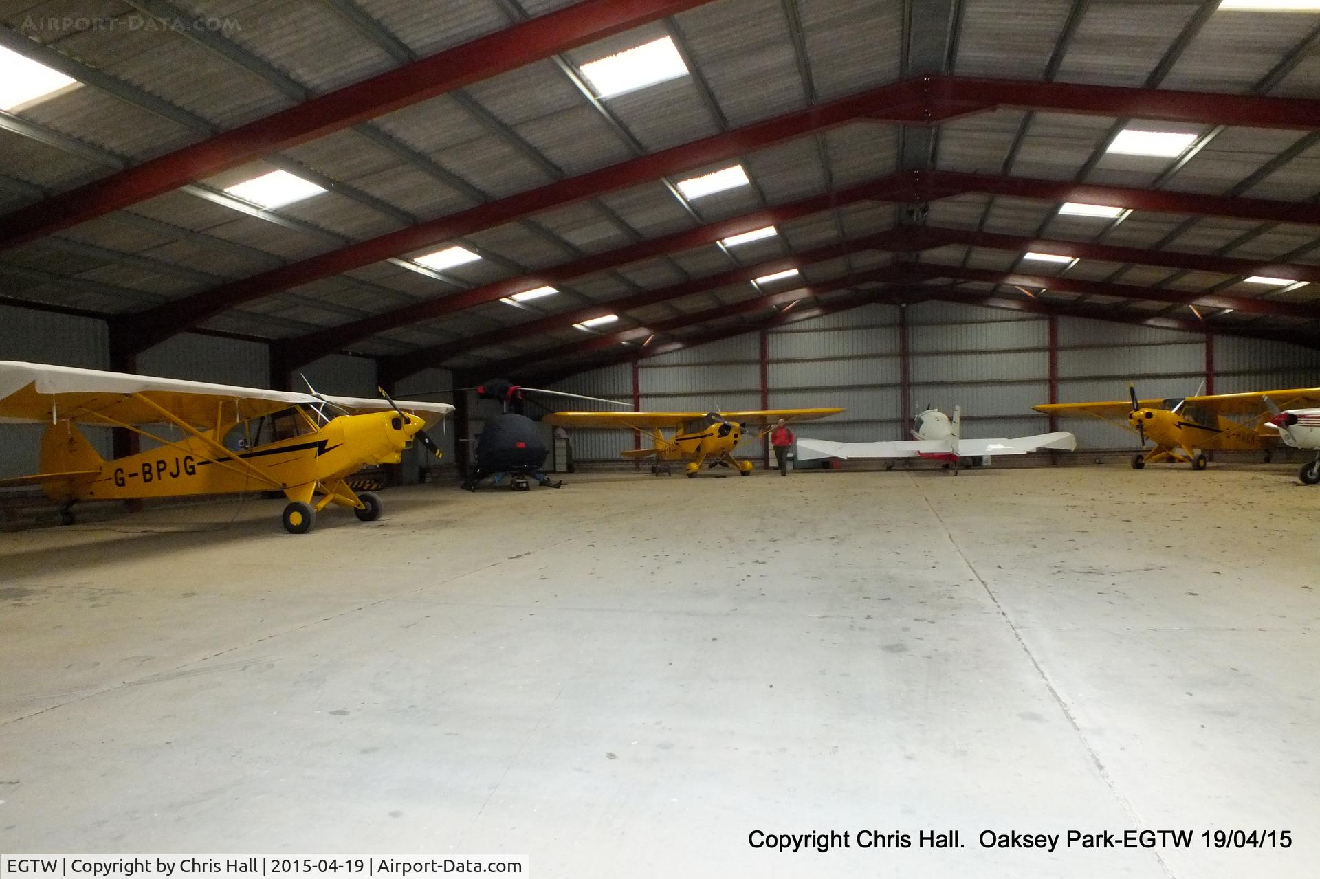 Oaksey Park Airport, Oaksey, England United Kingdom (EGTW) - one of the hangars at Oaksey Park