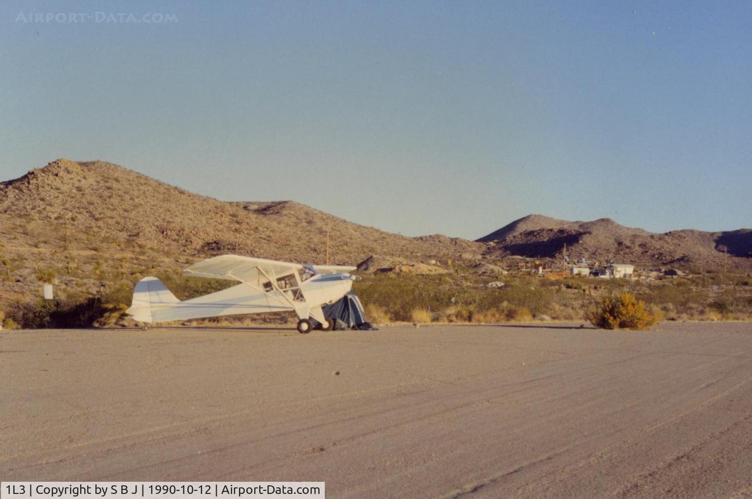 Searchlight Airport (1L3) - N39932 spending the night at Searchlight,Nevada airport).Was not much there in 1990. Lots of opportunity for expansion!! There was some road work for homes and hangars,but nothing more. Northerly view.