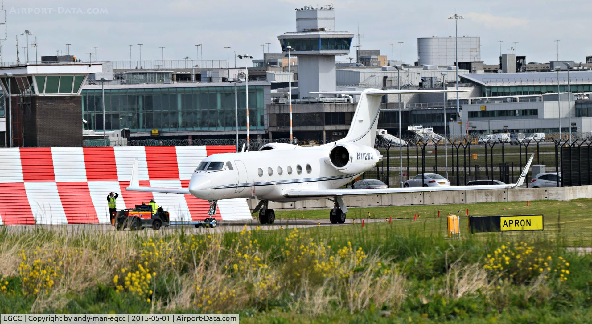 Manchester Airport, Manchester, England United Kingdom (EGCC) - being pulled by an landmark FBO tug on the the landmark FBO ramp