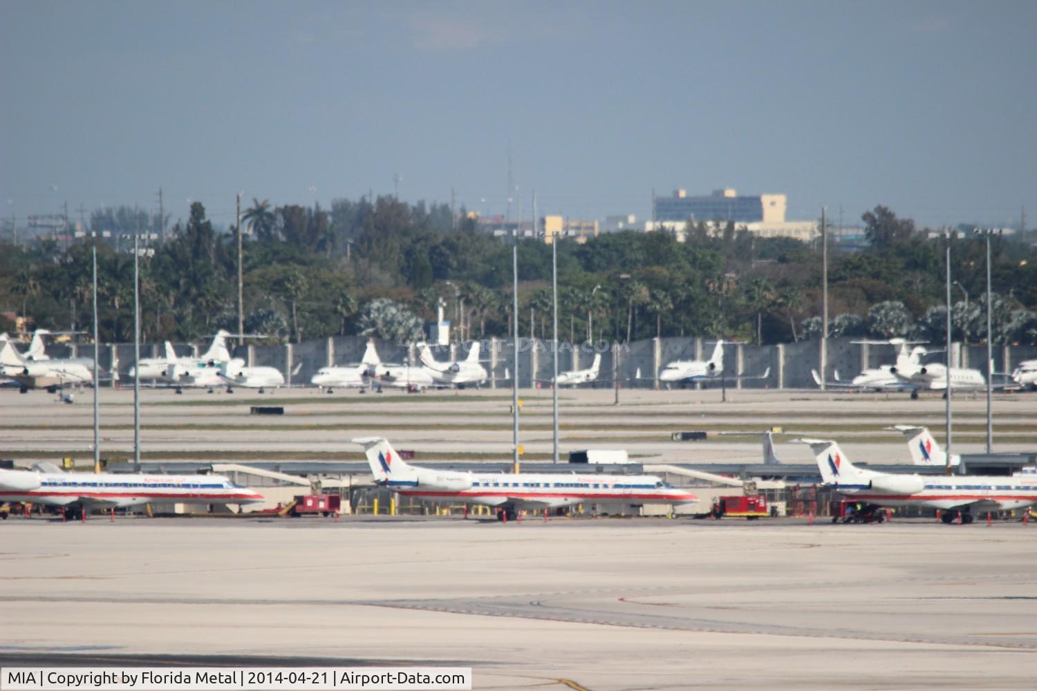 Miami International Airport (MIA) - American Eagle line up with biz jets in background