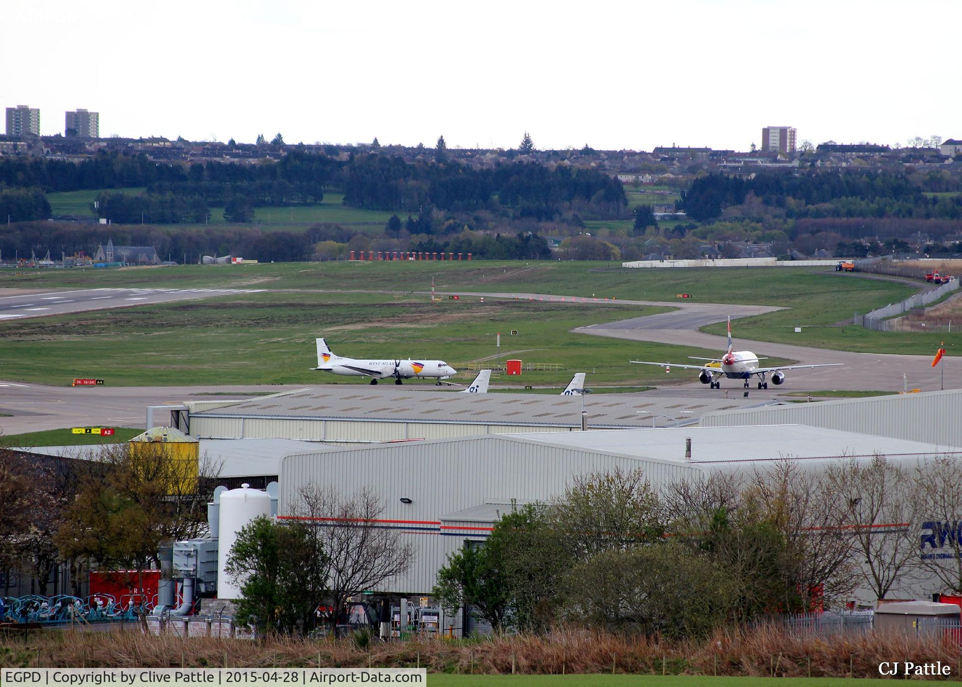 Aberdeen Airport, Aberdeen, Scotland United Kingdom (EGPD) - Looking South-Southeast across the airport at Aberdeen EGPD with a BA A320 taxying to the gate past a parked BAe ATP of West Atlantic Cargo.