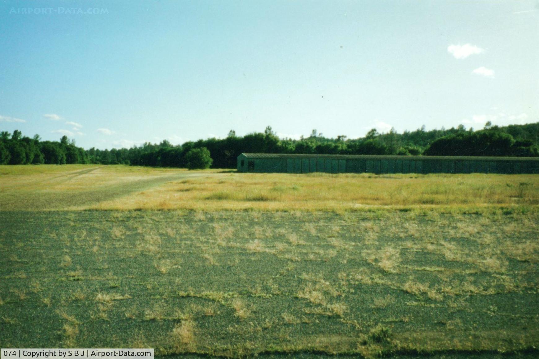 074 Airport - Redding Sky Ranch,Redding,Ca.Always loved airports called Sky Ranch.View is to the West and the crosswind runway ( upslope and trees at the west end ) with the few hangars the airport had.Was closed in 1993.