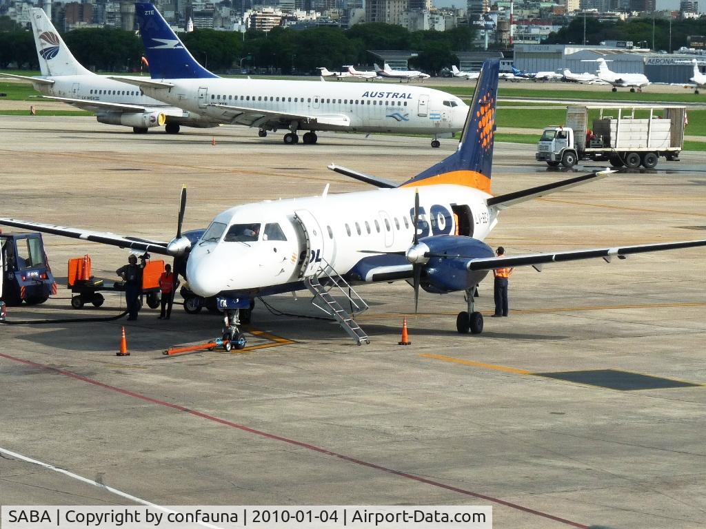 Buenos Aires Airport, Buenos Aires Argentina (SABA) - A SAAB 340 of SOL airlines in front and a Boeing 737 of Austral without the engines in the back 