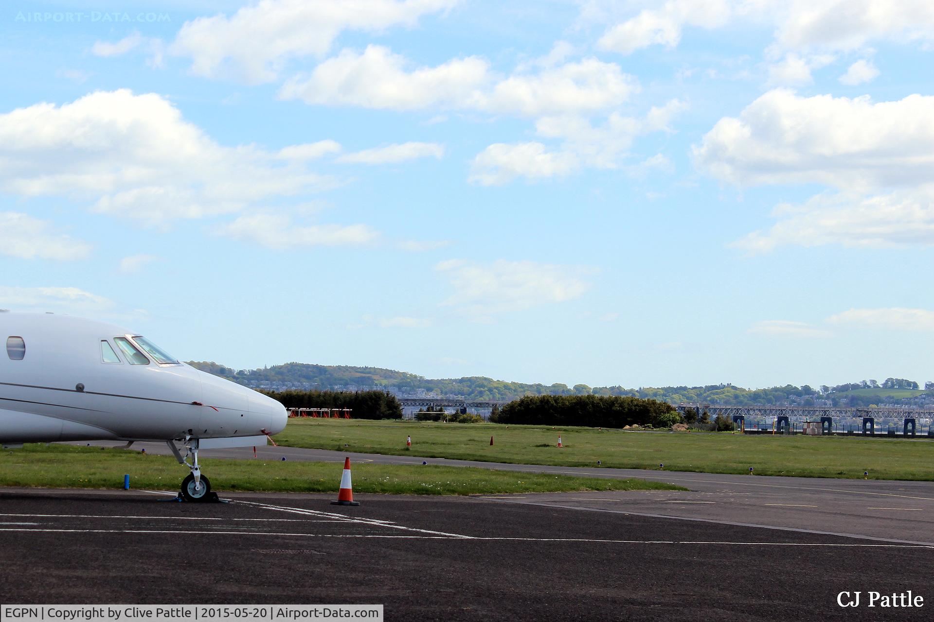Dundee Airport, Dundee, Scotland United Kingdom (EGPN) - A shot looking southeast across the airfield at Dundee Riverside airport (EGPN). Located on the north bank of the River Tay, the Tay Rail Bridge is visible in the background.