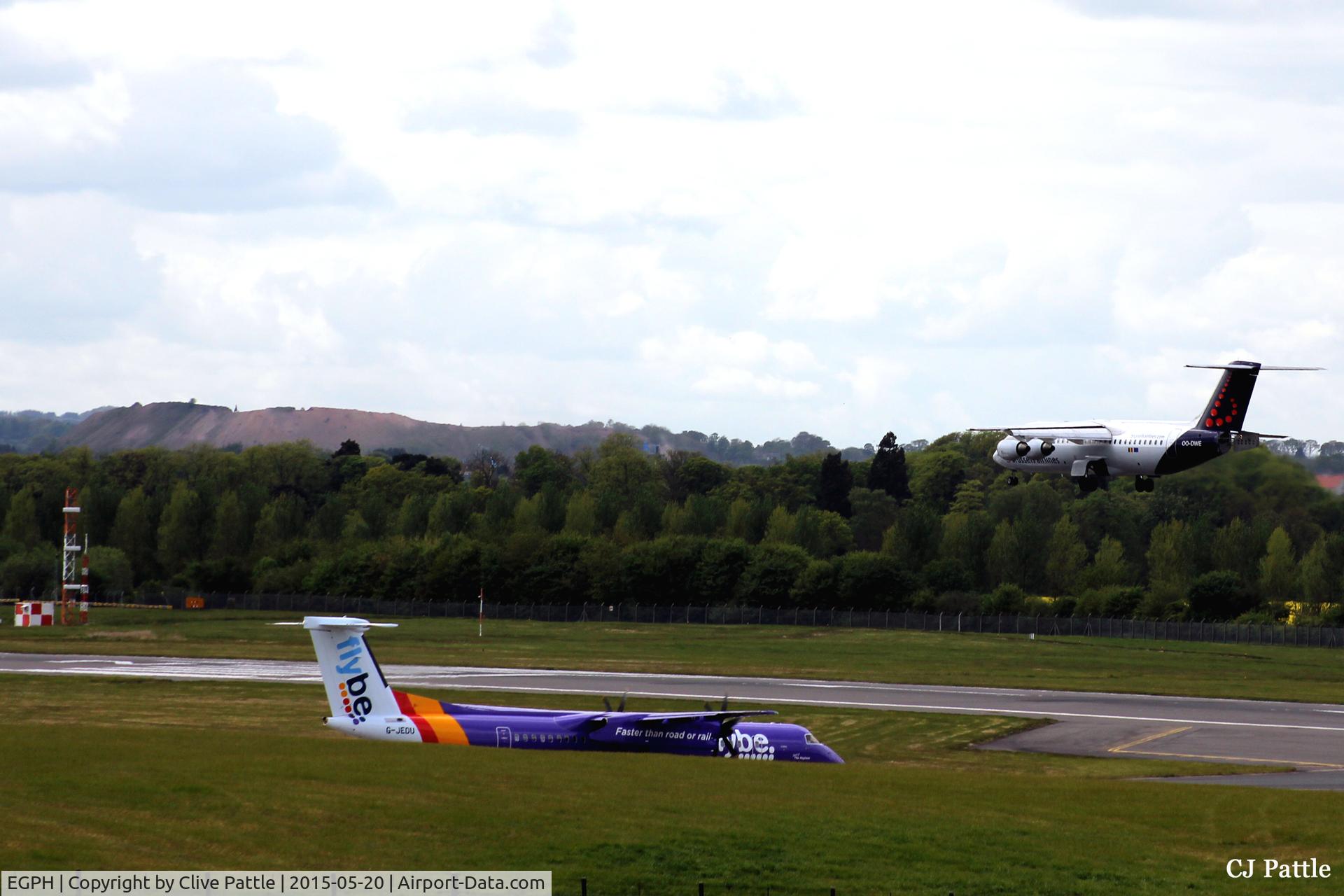 Edinburgh Airport, Edinburgh, Scotland United Kingdom (EGPH) - The airfield swallows a Flybe Dash 8 at Edinburgh EGPH