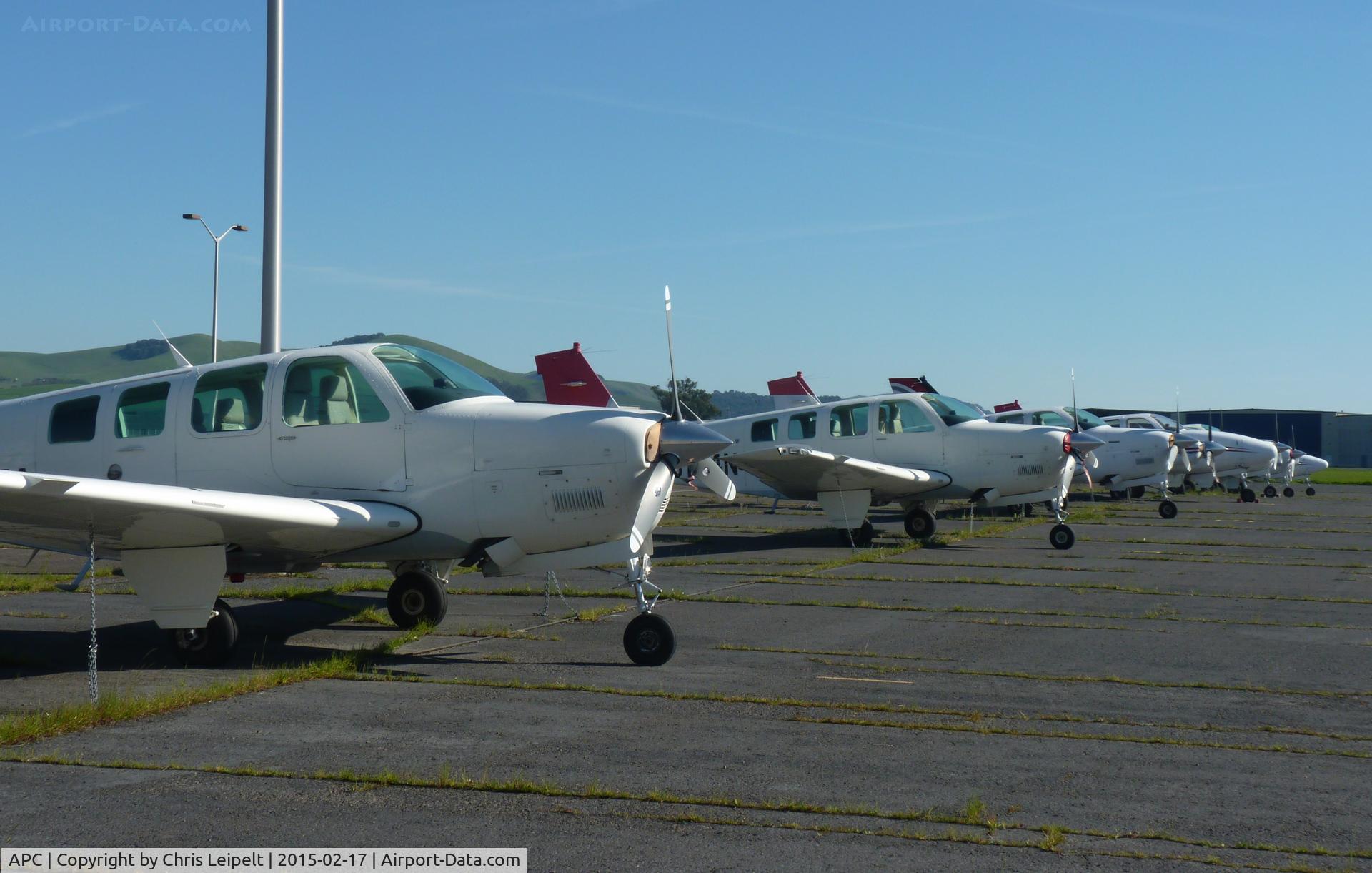 Napa County Airport (APC) - A long row of Beechcraft Bonanza 36's, each of them painted in the JAL livery.