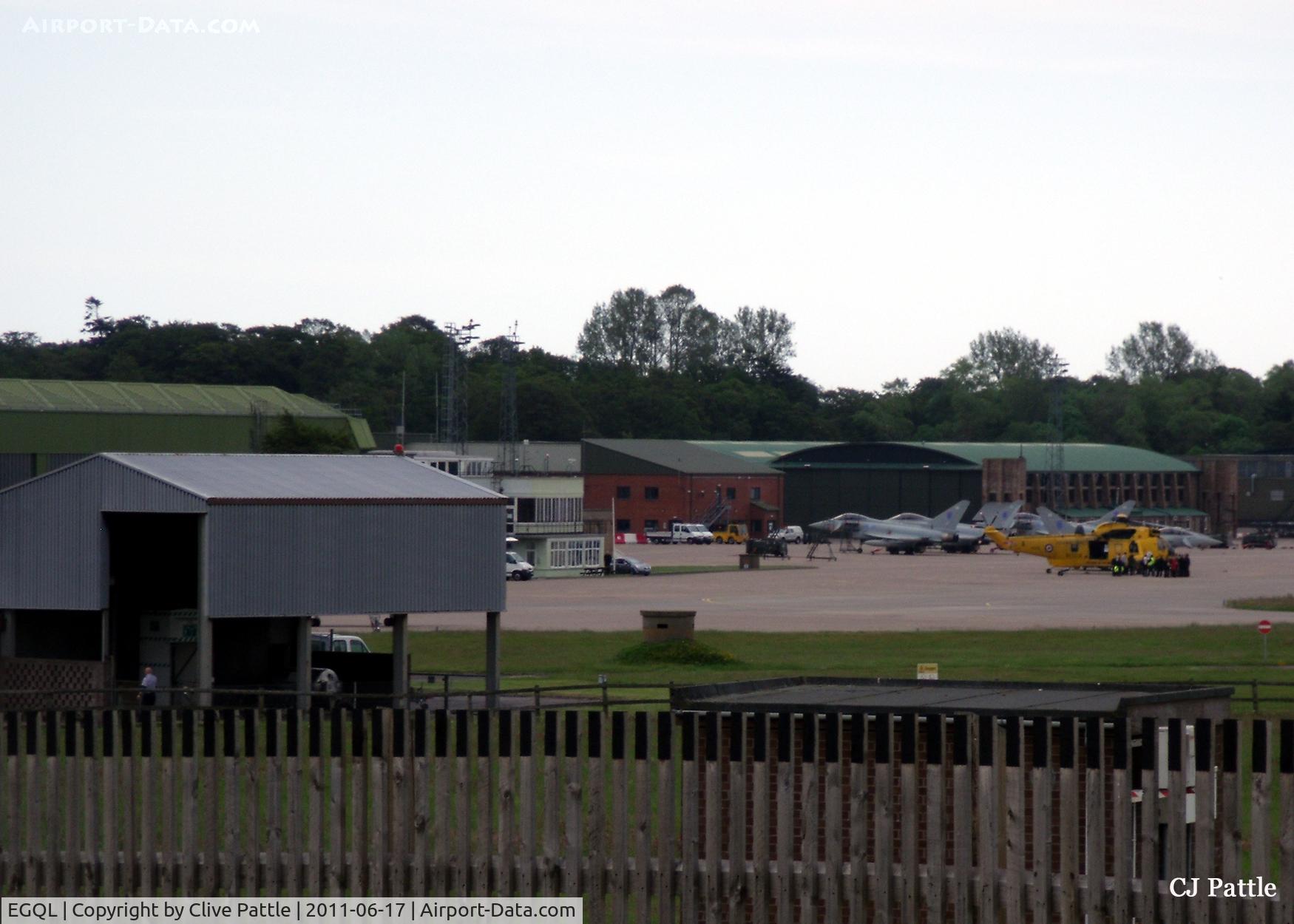 RAF Leuchars Airport, Leuchars, Scotland United Kingdom (EGQL) - A long distance shot of the ramp showing Typhoons and a Seaking