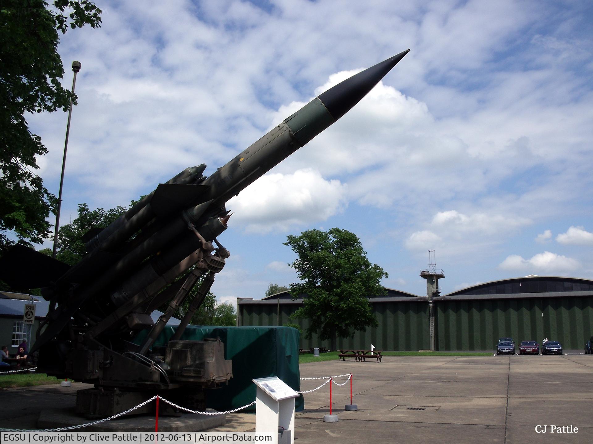 Duxford Airport, Cambridge, England United Kingdom (EGSU) - A view of a SAM system and WWII hangars at the IWM Duxford