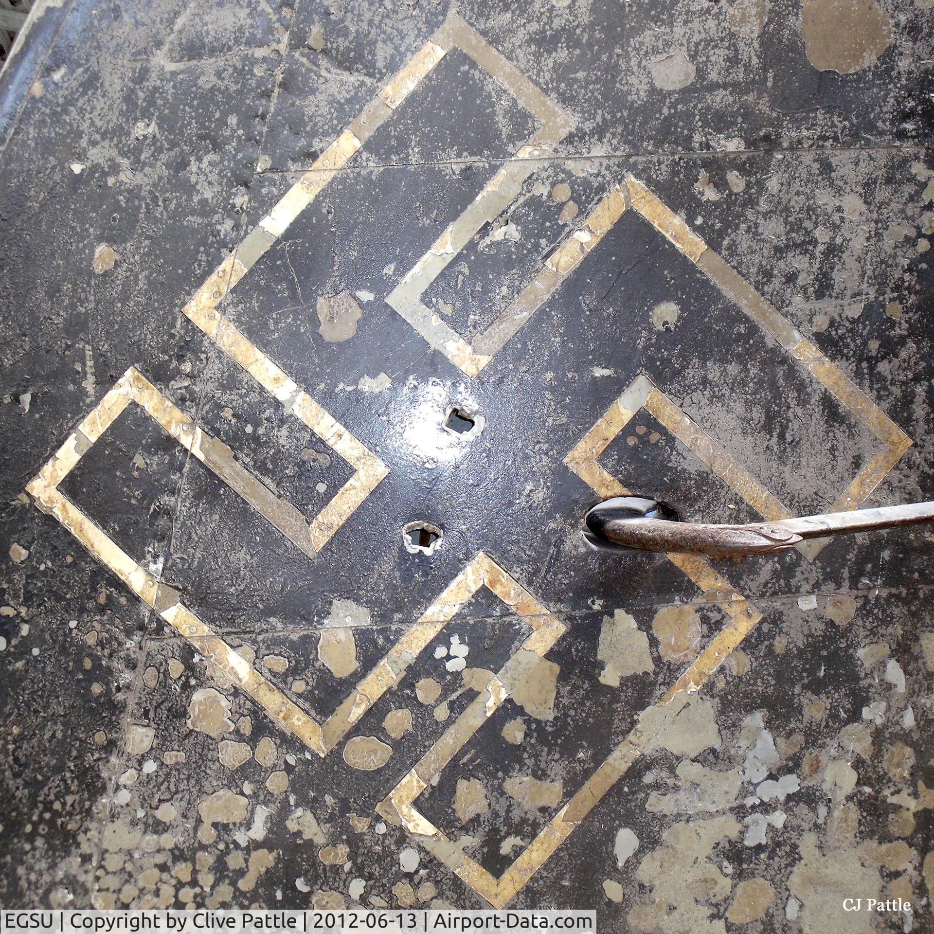 Duxford Airport, Cambridge, England United Kingdom (EGSU) - A close-up of the tail markings of an unidentified Heinkel HE-111 on display at the IWM Duxford showing not only the swastika marking but water damage after a period submerged and recovered from Storvatnet Lake, Norway in 1974.