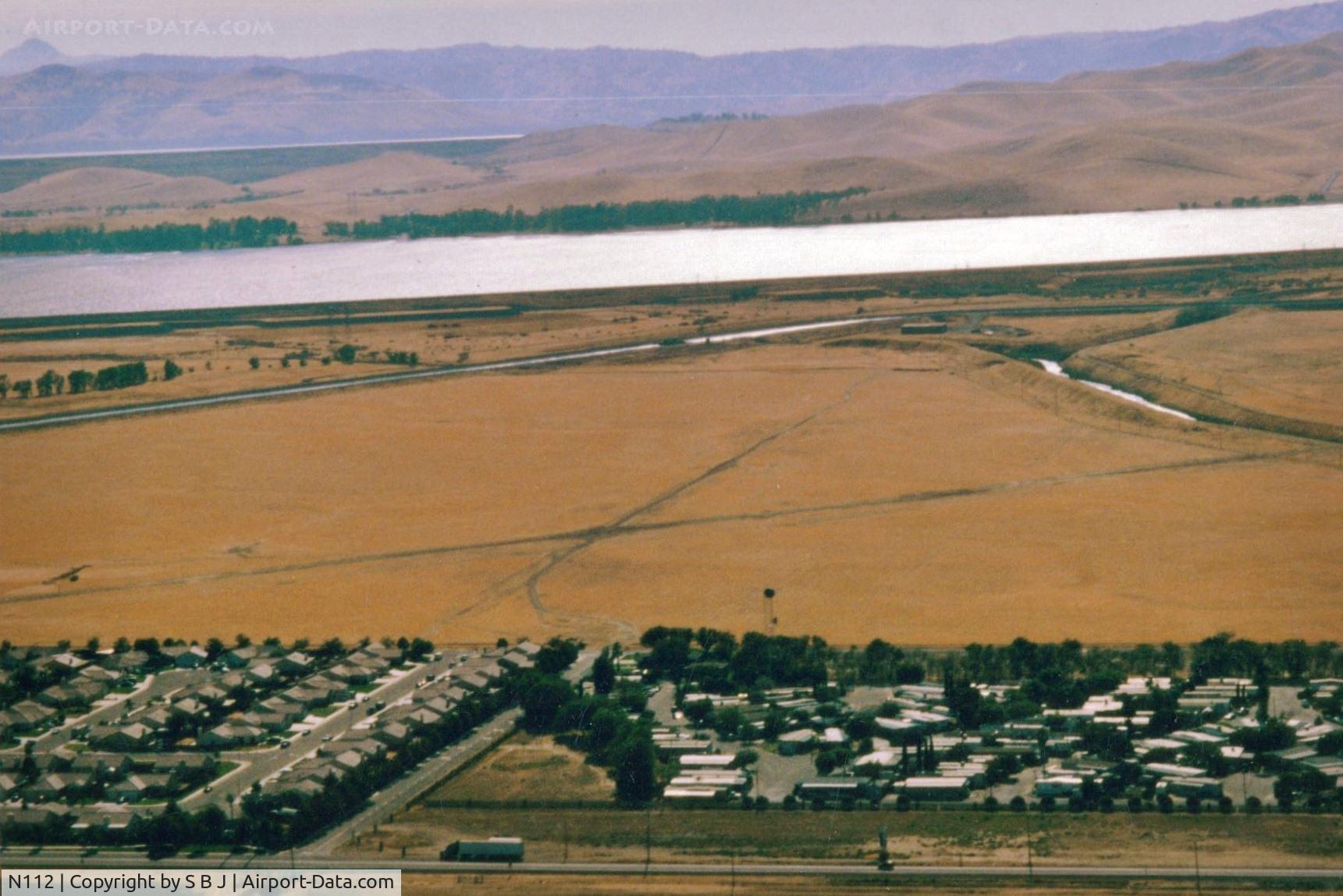 N112 Airport - Santa Nella airport,Ca.was a private-public use airport from mid 50s-90s.Used for parachuting in the last years.San Luis Reservoir seen at the very top of pic. which is near Los Banos,Ca.Landed there many times. View is SW.