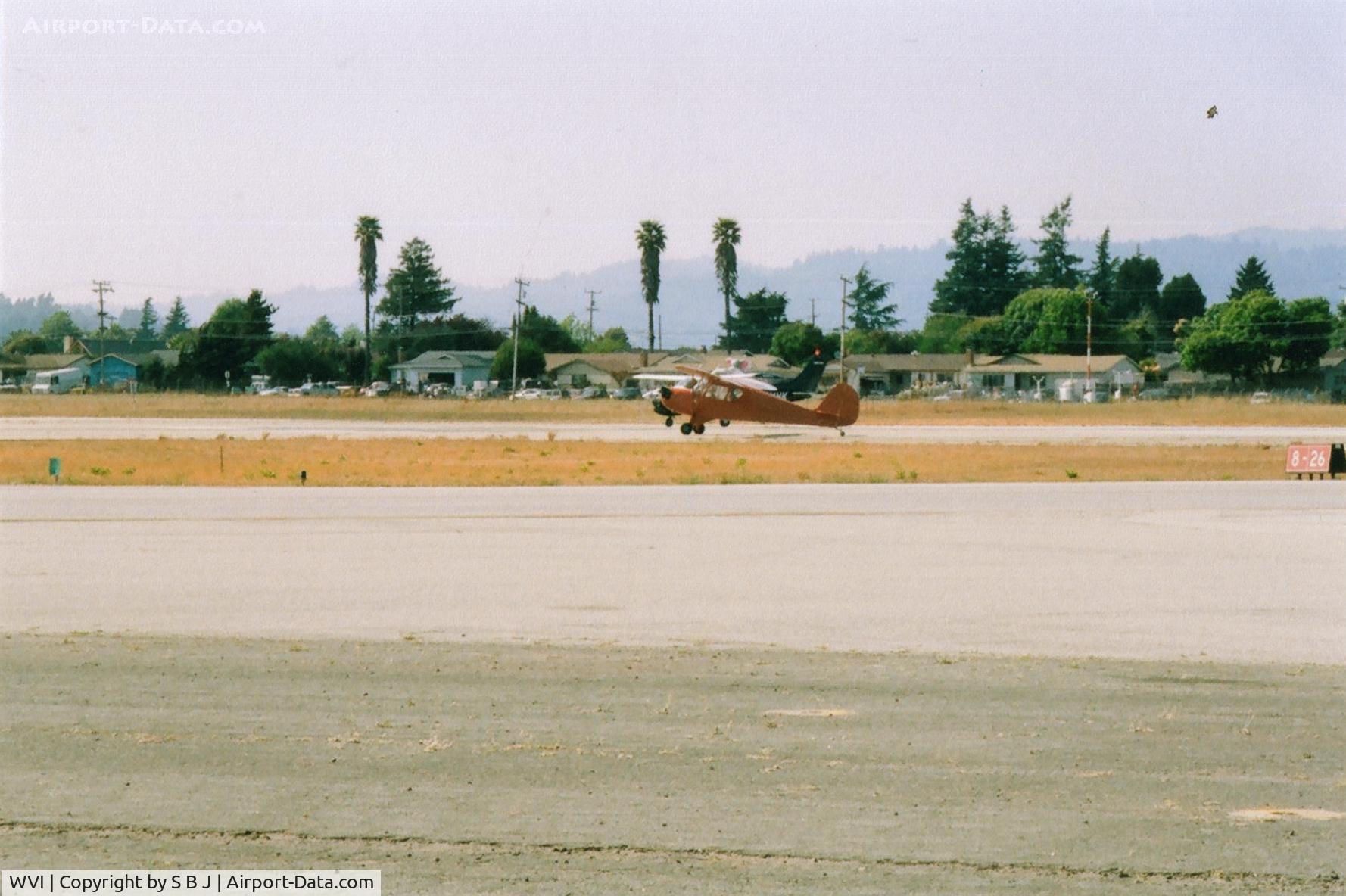 Watsonville Municipal Airport (WVI) - Aeronca L3 and Cessna 210.If it is a  race, my money is on the 210, but off frist ??? Both in position for departure from the Watsonville Flyin in Calif.
