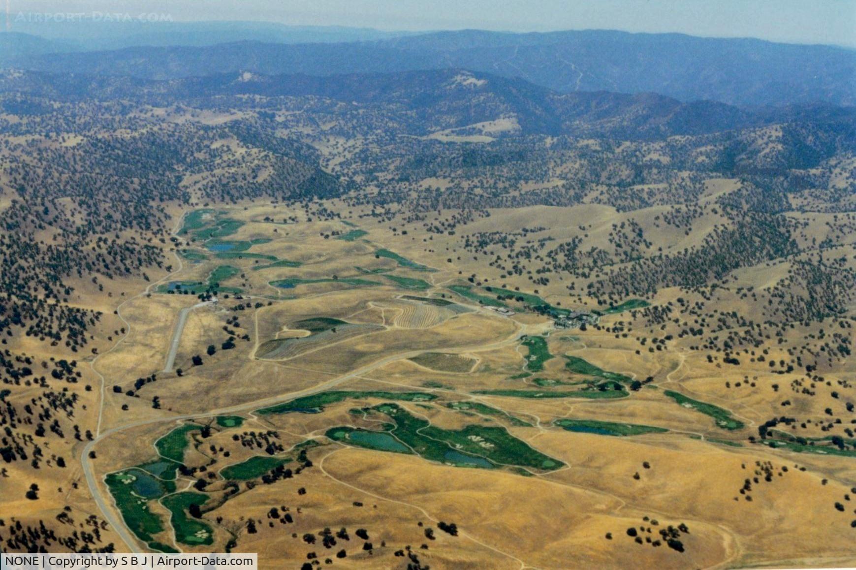 NONE Airport - Large cattle ranch strip near Patterson,Ca.till it was sold for development of high end homes.The paved runway is seen on the left where the road turns right.Flew over it many times but never landed. View is to the west.