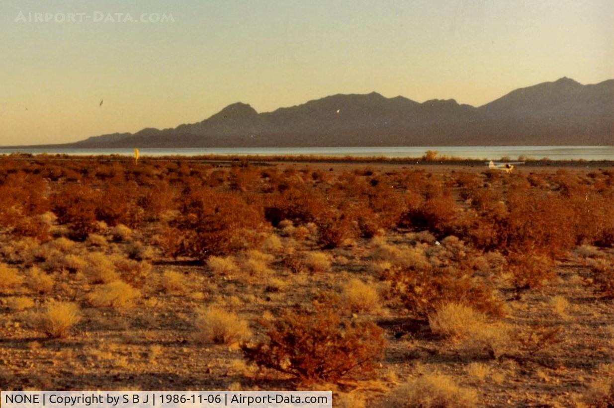 NONE Airport - Cottonwood Landing,Az.which was 18 miles from Searchlight,Nv. This fantastic public use dirt strip was only 100 feet from the Colorado River.Was closed befor my second visit in 1990.Knew it was much to nice to stay open!! View is to the SW.