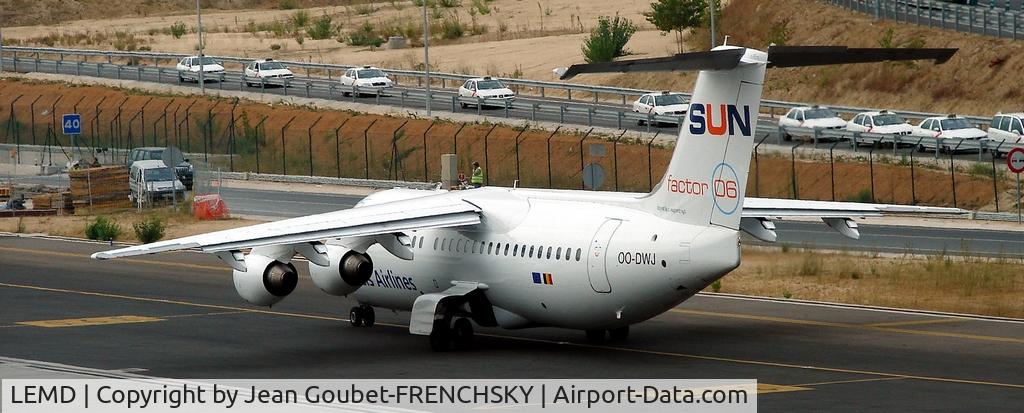 Barajas International Airport, Madrid Spain (LEMD) - plane on taxiway and taxi on the road....