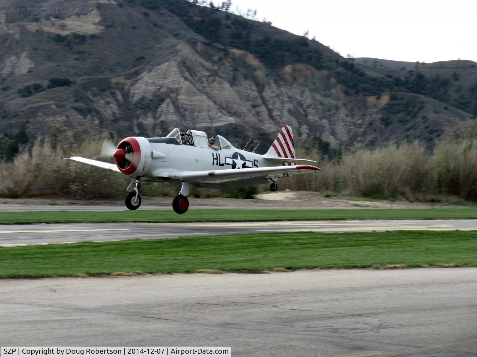 Santa Paula Airport (SZP) - Condor Squadron return to airport from 7 Dec. 1941 Pearl Harbor attack Commemoration target bombing, landing Rwy 04 
