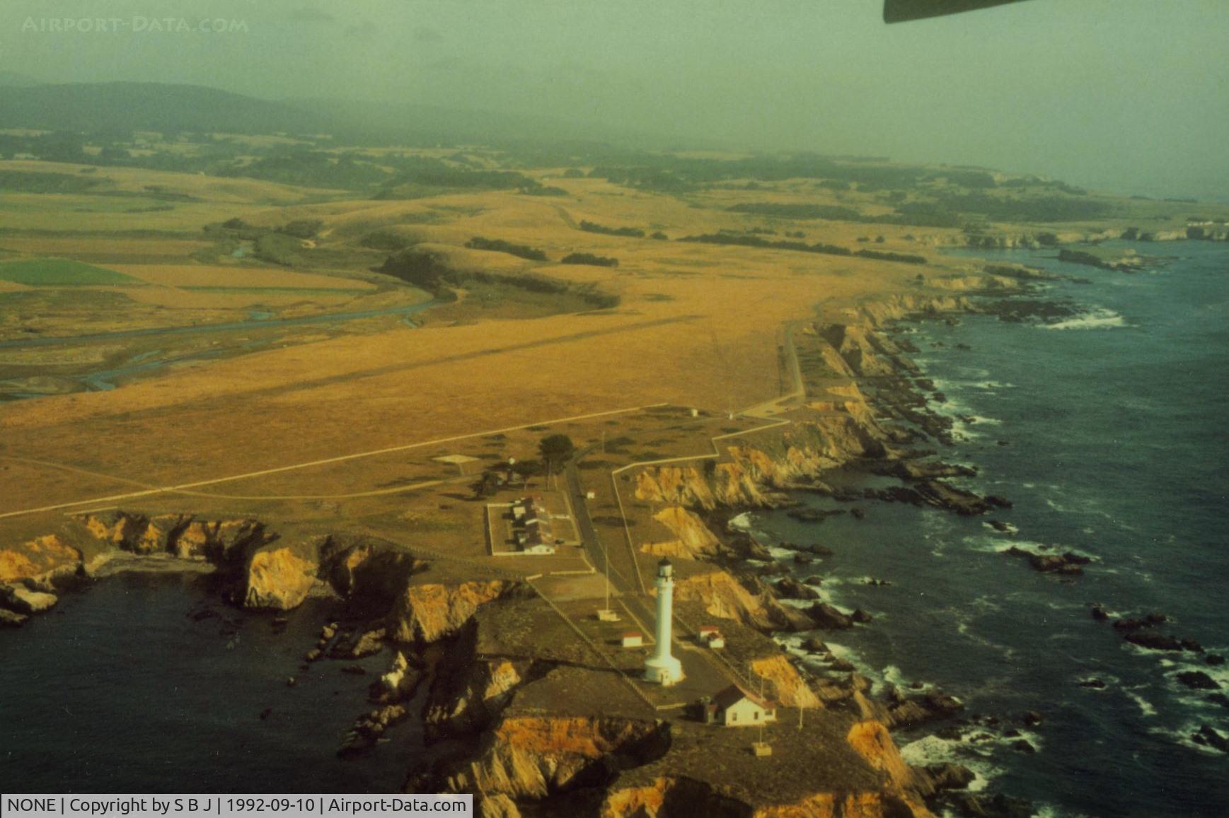 NONE Airport - Point Arena lighthouse helicopter pad on the beautiful North Calif. coast.This picture (1992) shows better the possible dirt runway. Was told the final (touching) scene in the 1992 movie Forever Young with the B25 landing near the water, was filmed here.