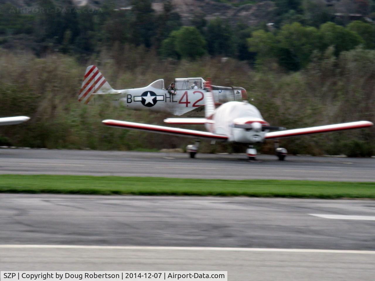 Santa Paula Airport (SZP) - Condor Squadron making another (very low) high speed flour bombing pass at riverbed target Commemorating 7 Dec. 1941 attack on Pearl Harbor. Each aircraft made multiple passes/drops to be scored.