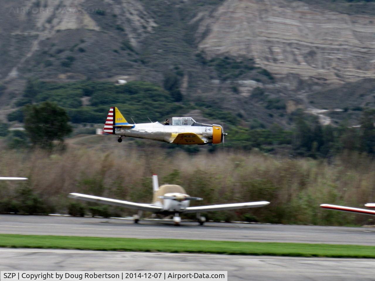 Santa Paula Airport (SZP) - Condor Squadron making another high speed flour bombing pass at riverbed target Commemorating the 7 Dec. 1941 attack on Pearl Harbor.