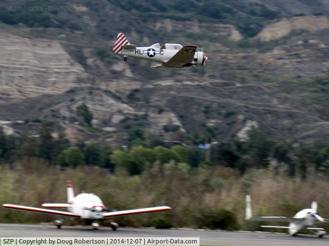 Santa Paula Airport (SZP) - Condor Squadron making another high speed pass flour bombing the riverbed target Commemorating the 7 Dec. 1941 attack on Pearl Harbor.