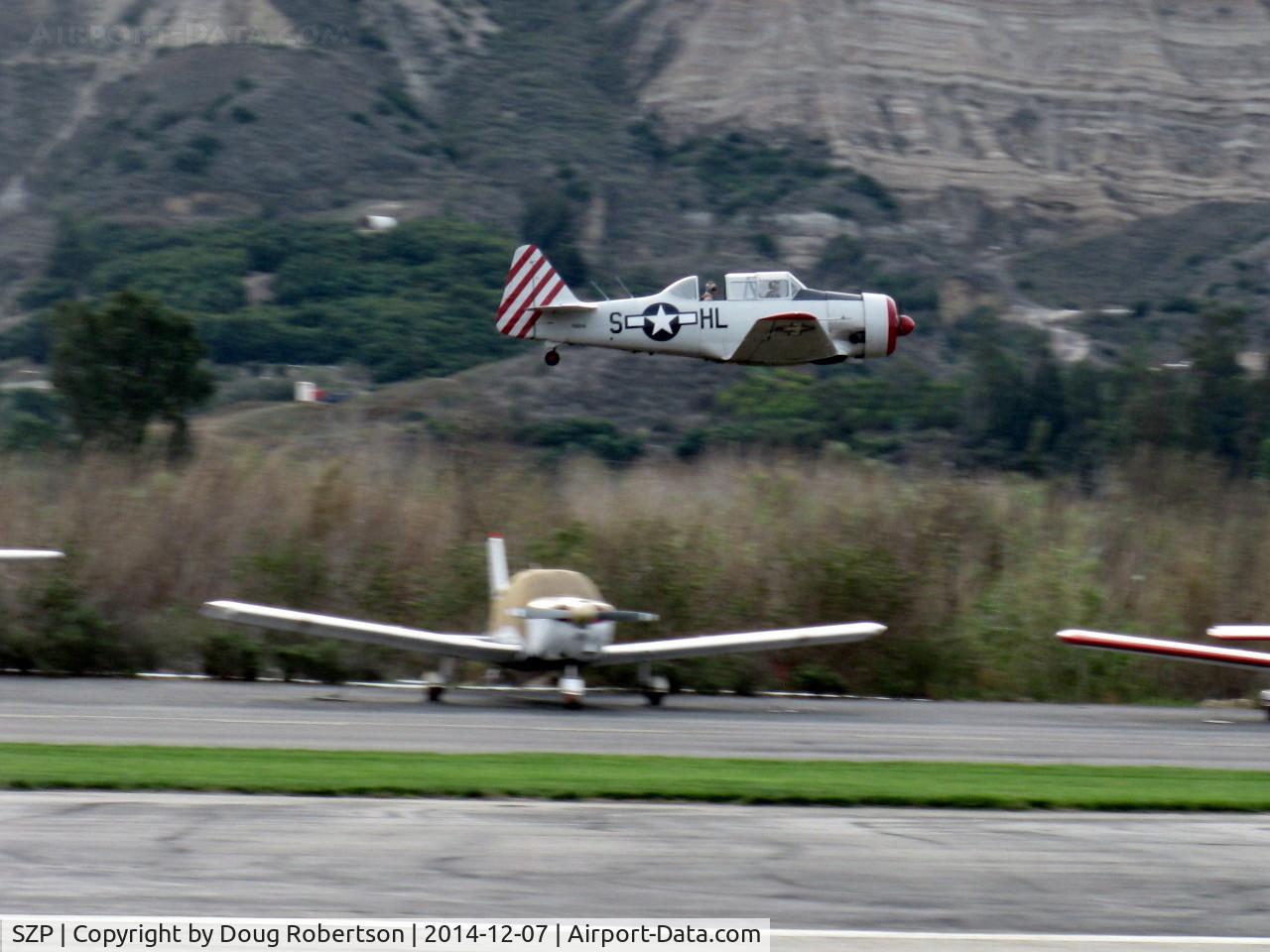 Santa Paula Airport (SZP) - Condor Squadron making another high speed flour bombing pass at the Santa Clara River-bed target Commemorating the 7 Dec. 1941 attack on Pearl Harbor