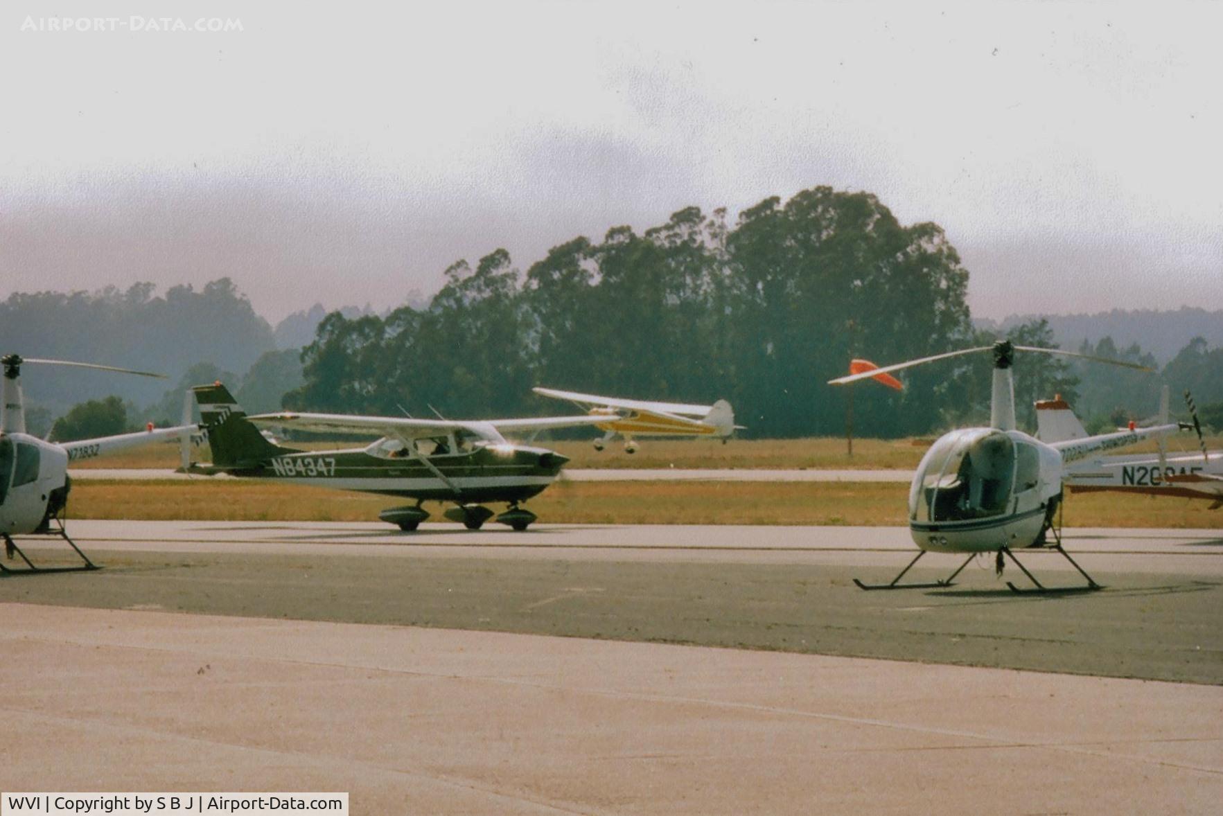 Watsonville Municipal Airport (WVI) - End of airshow with planes ready for departure as Tcraft lifts off.Notice the fog which was always a concern.Reason airshow moved to end of year.Weather prevented me from attending two airshows (attempted but turned back) in the 80s.