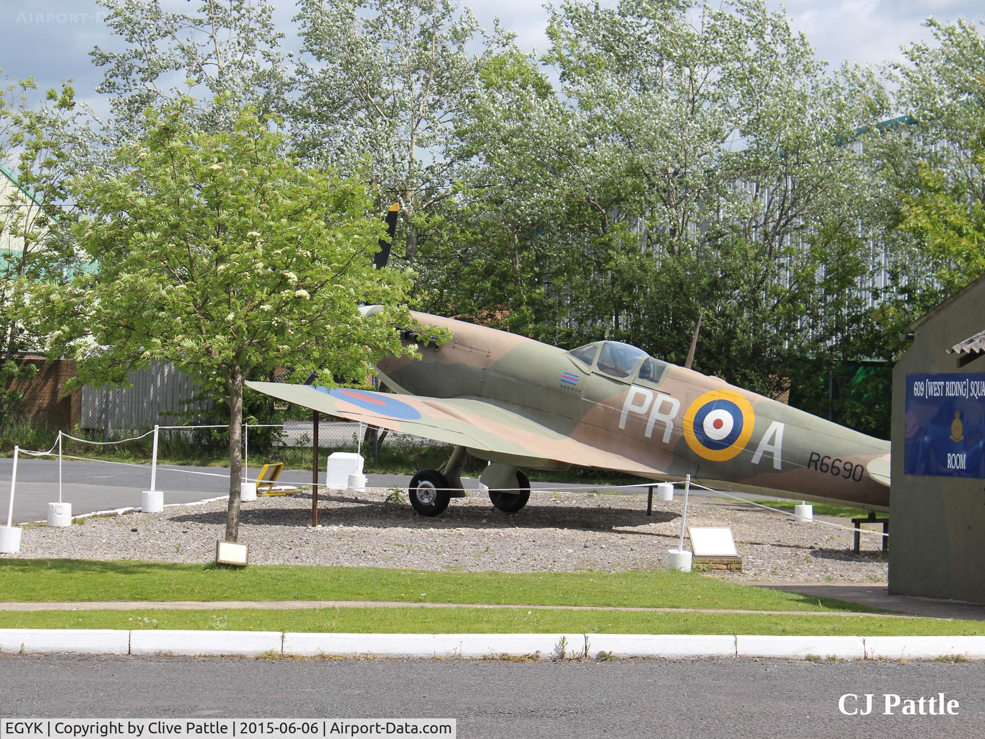 EGYK Airport - A view of the 609 (West Riding) Sqn RAF memorial building and FSM Spitfire on external display at the Yorkshire Aviation Museum, Elvington.