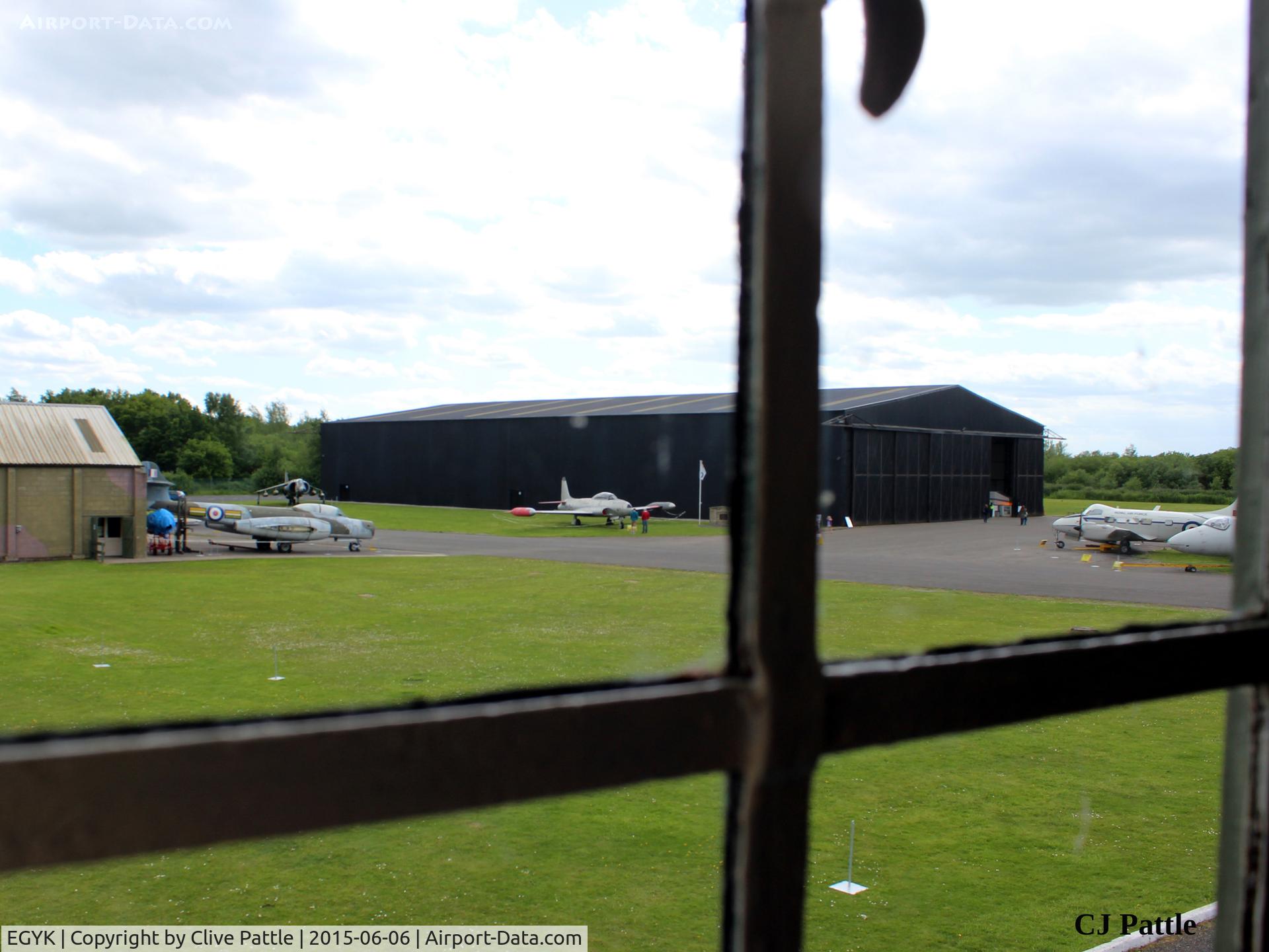 EGYK Airport - A view from the first floor of the Watchtower at RAF Elvington towards some of the displayed exhibits and hangars
