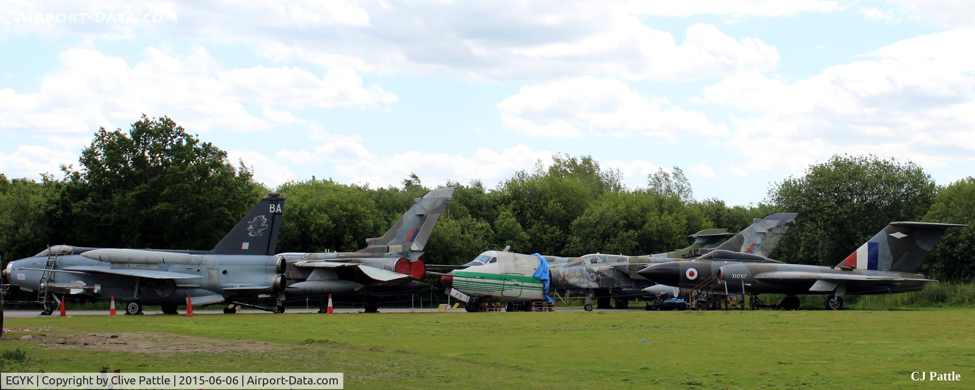 EGYK Airport - Aircraft awaiting restoration/repair/respray at the Yorkshire Air Museum are currently stored at the rear of the main hangar. Included are a Lightning, 2 x Tornado (GR1 and GR4), the nose from an HP Herald, a Javelin and a Buccanear.