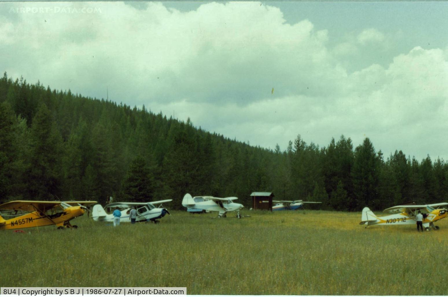 Spotted Bear /usfs/ Airport (8U4) - Spotted Bear with view to the NW. This is the main camping and tiedown area.The truck seen behind my Piper Colt, was for transportation to the near by lodge.Yes indeed, it was nice for these taildragger pilots to let me fly along.
