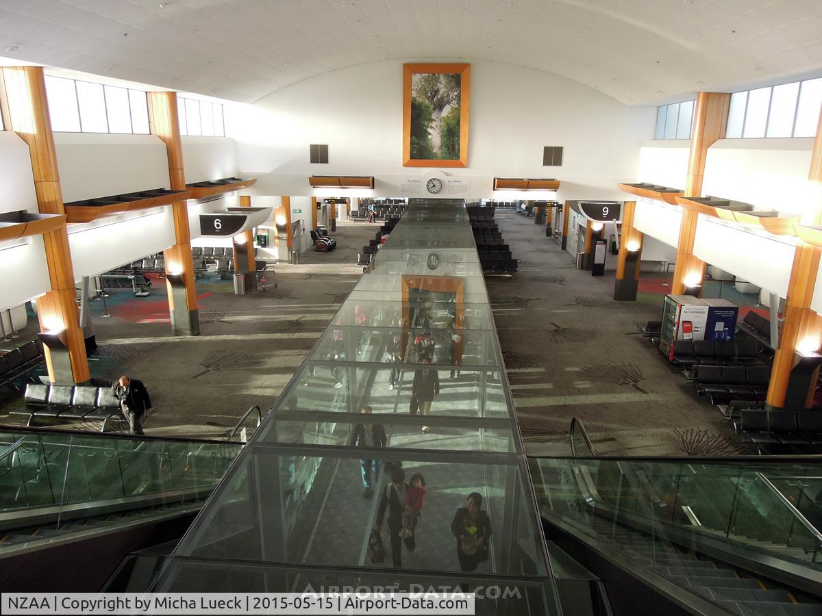 Auckland International Airport, Auckland New Zealand (NZAA) - Incoming passengers walking through a glass tunnel