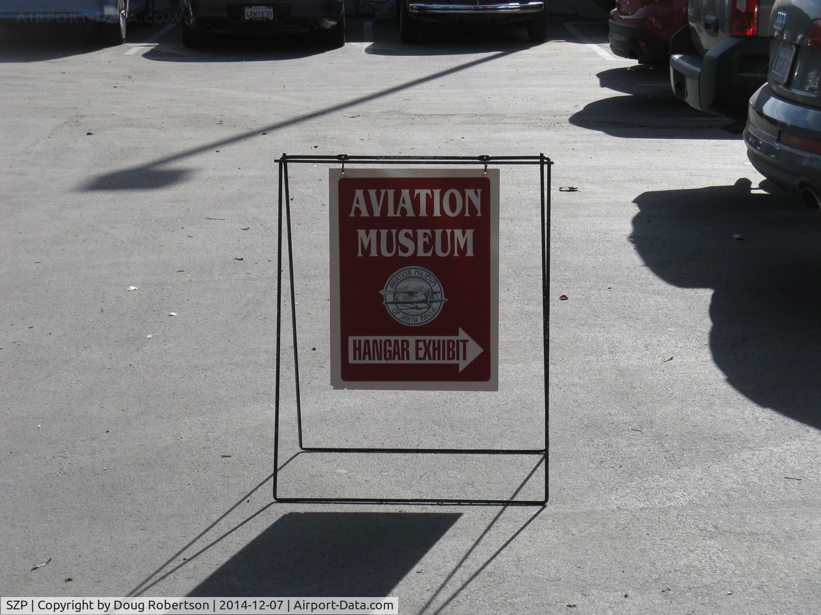 Santa Paula Airport (SZP) - Aviation Museum directional sign. Open First Sundays 10-3, rain cancels