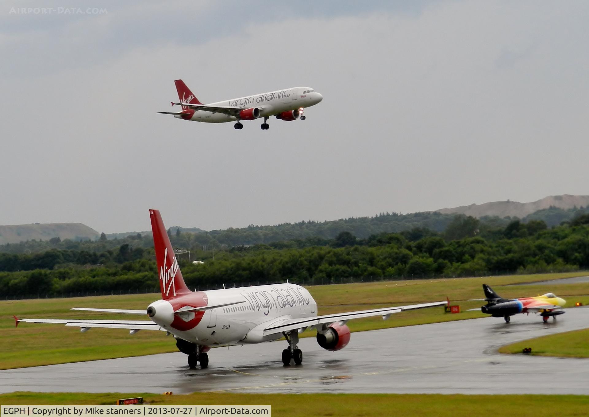 Edinburgh Airport, Edinburgh, Scotland United Kingdom (EGPH) - Virgin A320-214 EI-DEO Landing runway 06 while Virgin A320 EI-EZW And Hunter G-PSST Hold 