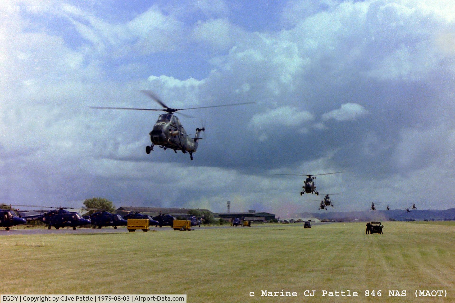 RNAS Yeovilton Airport, Yeovil, England United Kingdom (EGDY) - Scanned from negative - RNAS Yeovilton EGDY during the 1979 Airshow 'Commando Assault' with Wessex of 707, 845 and 846 NAS displaying their skills. Lynx HAS.2 of 702 NAS line-up on left.