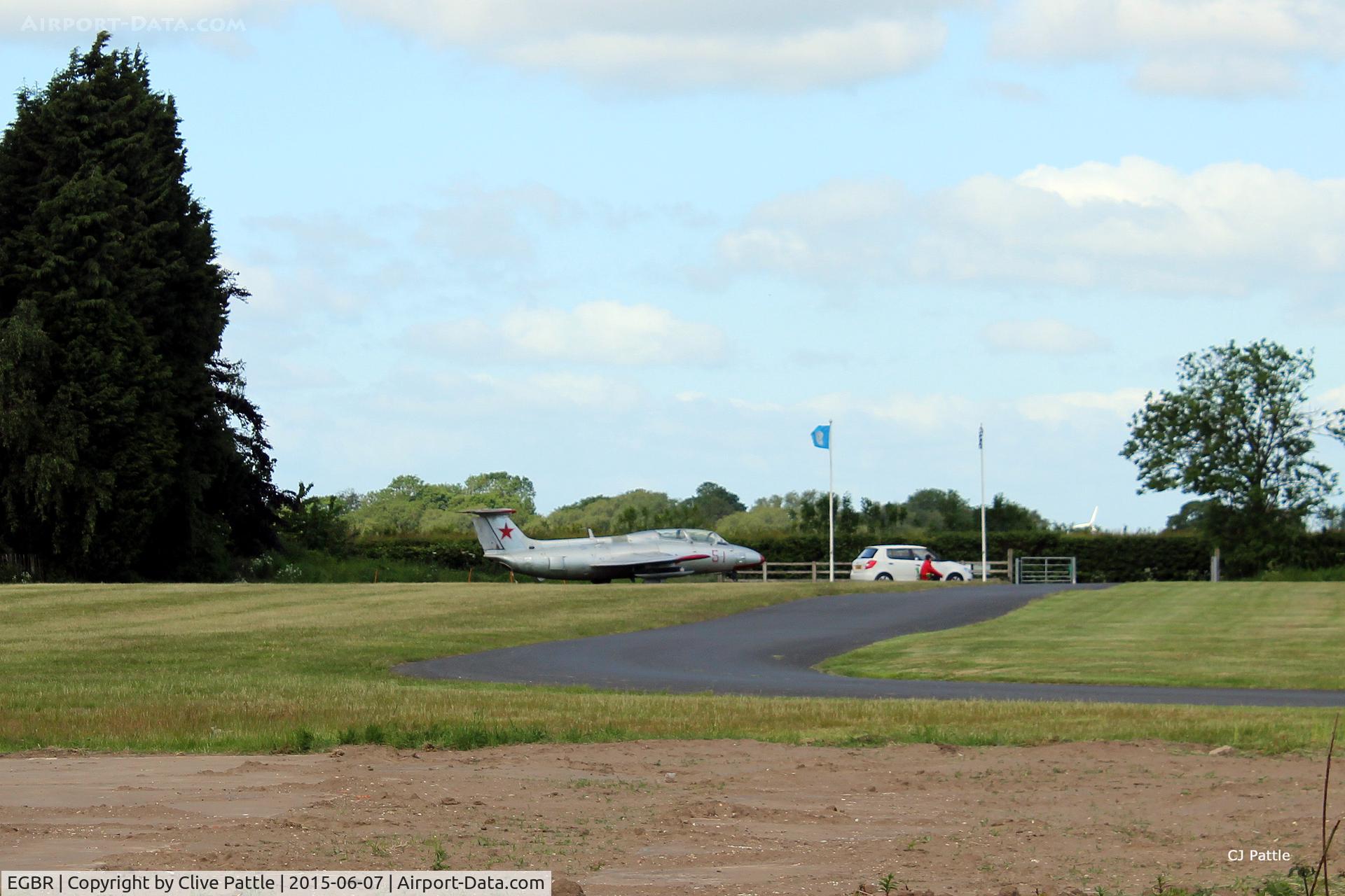 EGBR Airport - The Main Gate Sentry on duty at the Radial Fly-in day at Breighton, Yorks - EGBR - with Aero L-29 Delphin YL-PAG close at hand.