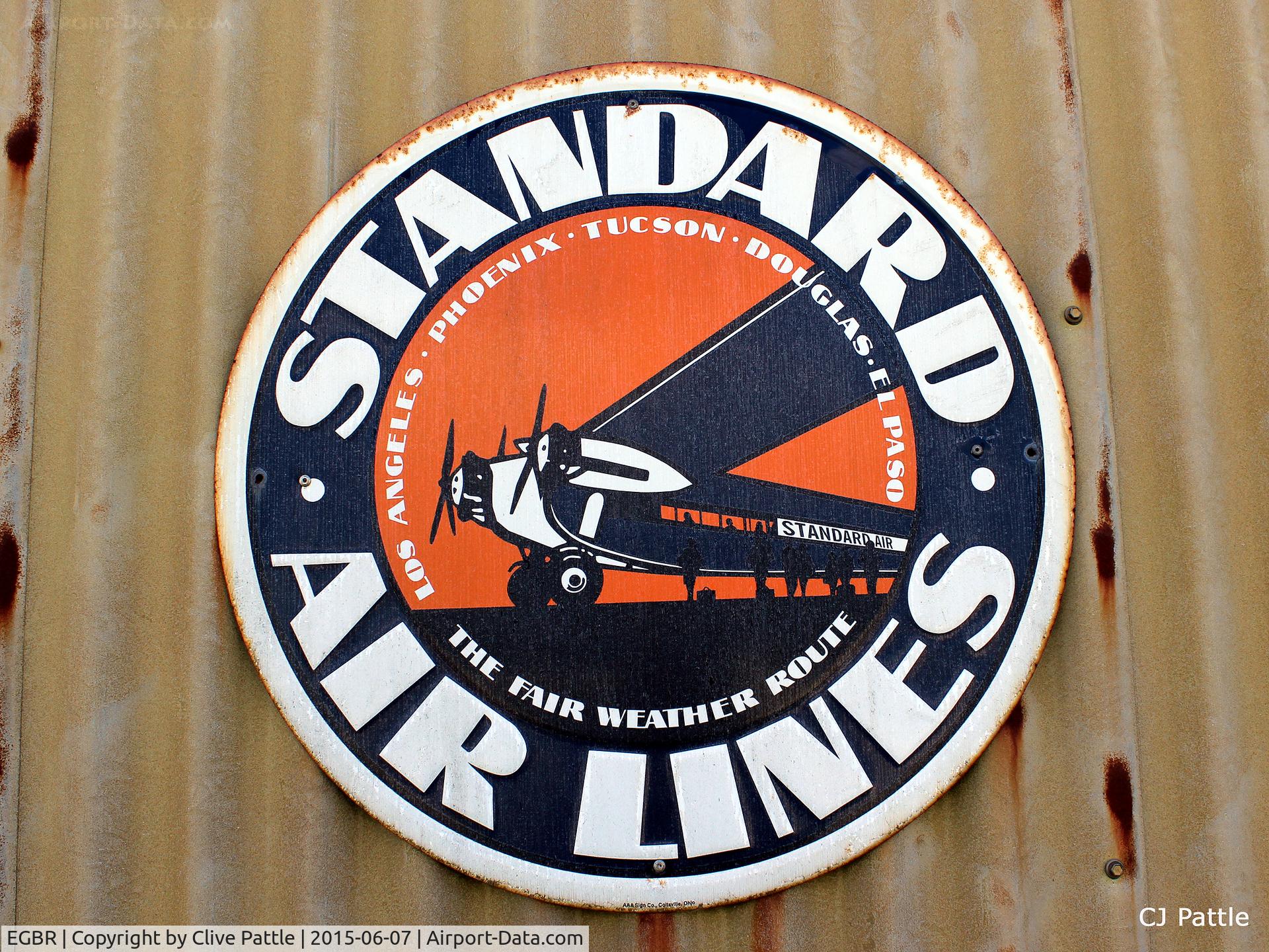 EGBR Airport - An advertising sign mounted on a hangar at Breighton Airfield, Yorkshire - EGBR