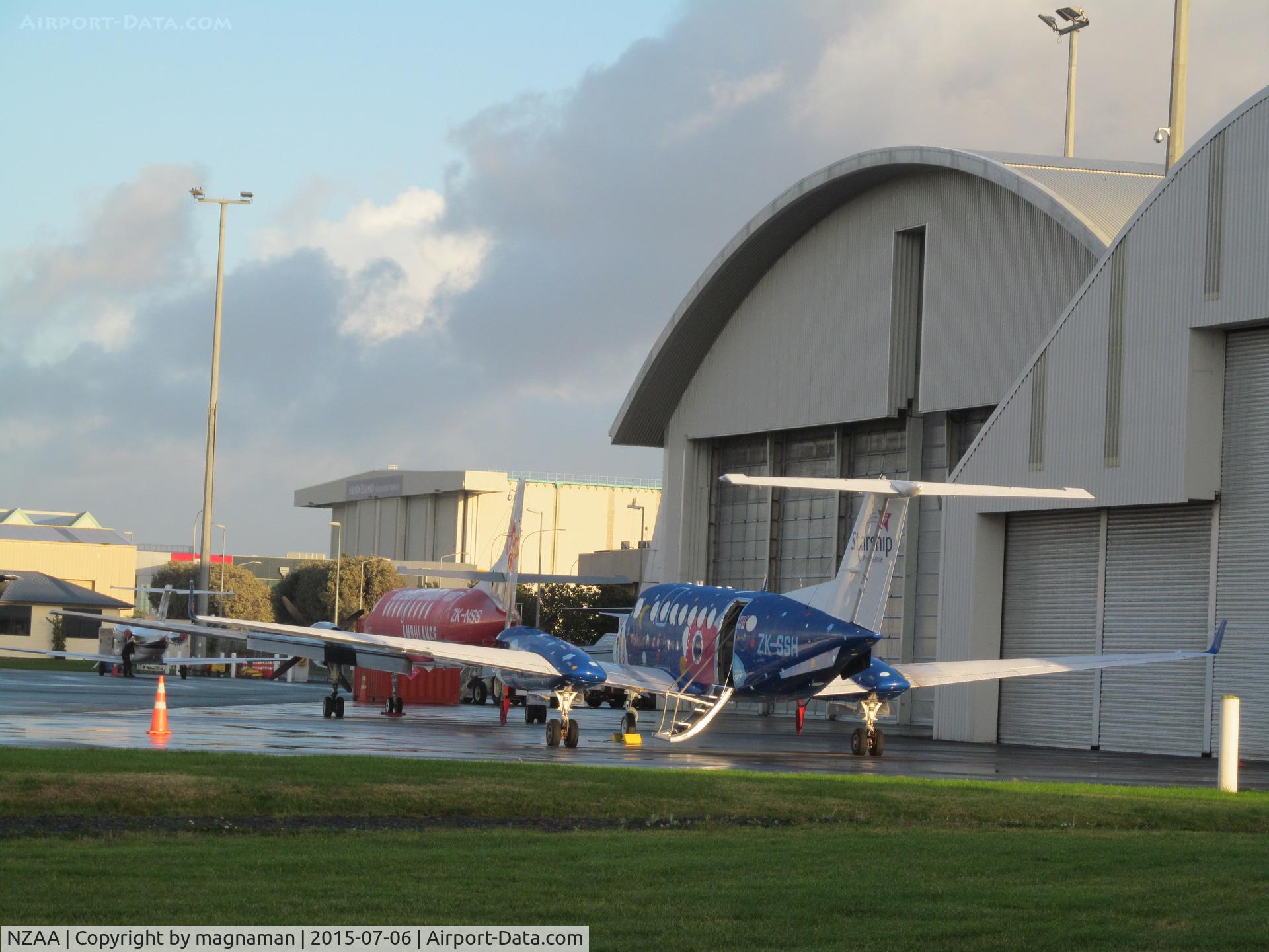 Auckland International Airport, Auckland New Zealand (NZAA) - Part of convair apron with local medic aircraft (ZK-SSH and ZK-NSS) - apron can be seen from approach road of SW motorway (Puhunui Road)