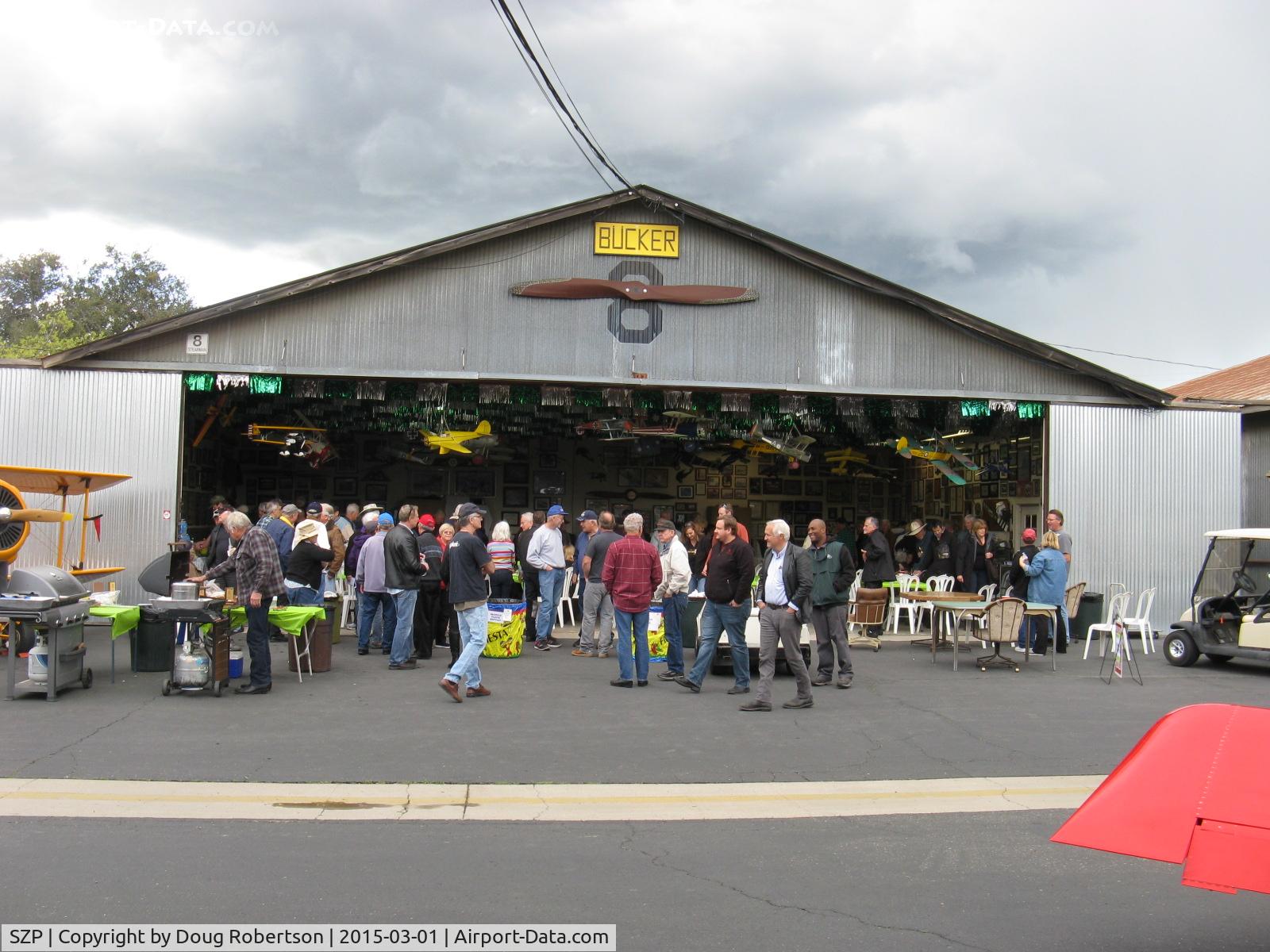 Santa Paula Airport (SZP) - Pat Quinn's Museum Hangar-on the occasion of his receiving the FAA Master Pilot Award for 50 years accident free-no violations flying. The well-attended luncheon ceremony guests dispersing from a great party!