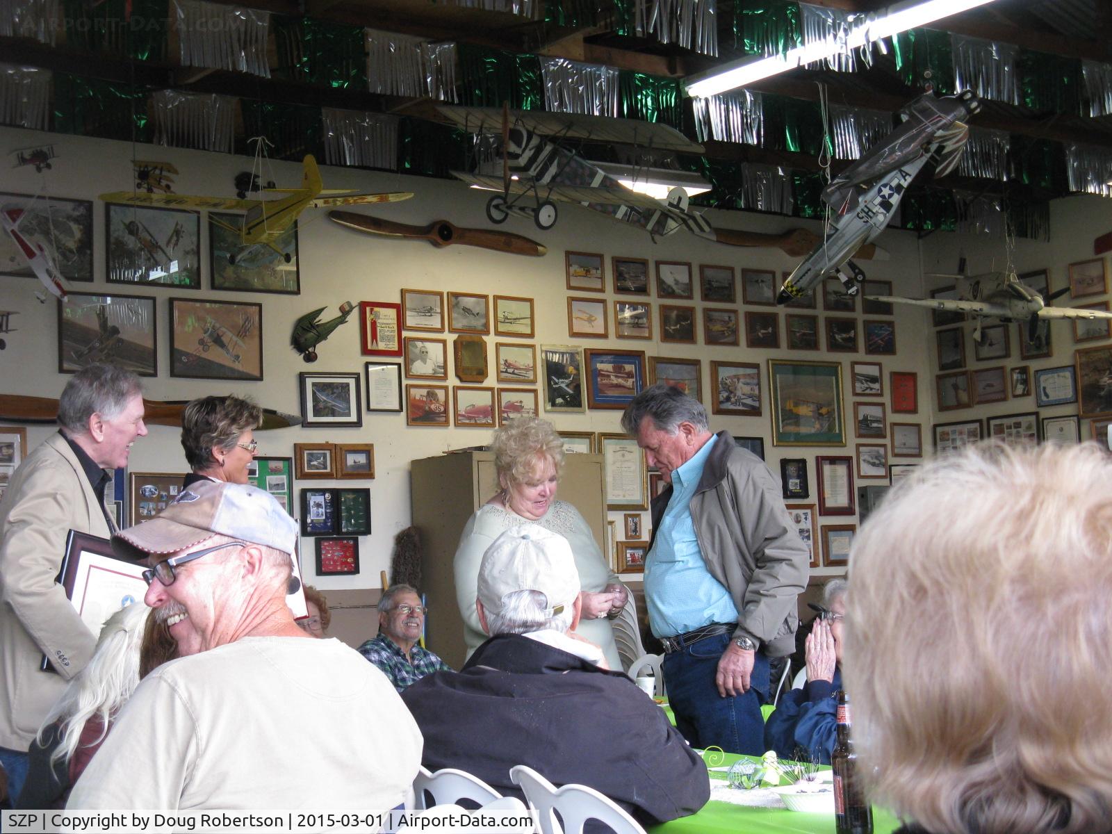 Santa Paula Airport (SZP) - Pat Quinn's Bucker Museum Hangar luncheon party on the occasion of his receiving the FAA Master Pilot Award for 50 years accident free-no violations flying. Proud Arlys and Pat at the award ceremony.