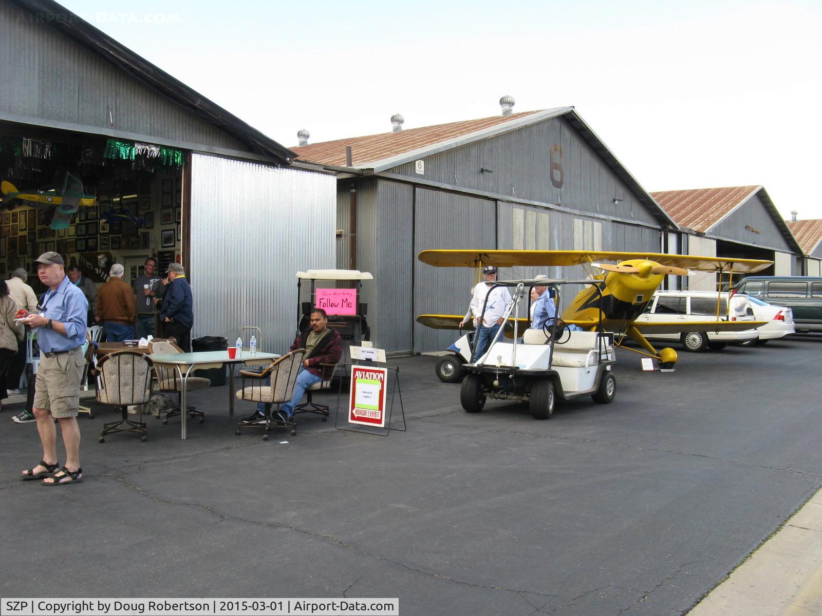 Santa Paula Airport (SZP) - The Pat Quinn Bucker Museum hangar with his Jungmann flanking the hangar. Pat will receive the FAA Master Pilot Award today for 50 years accident free-no violations flying. Pat a retired LAFD helicopter pilot.