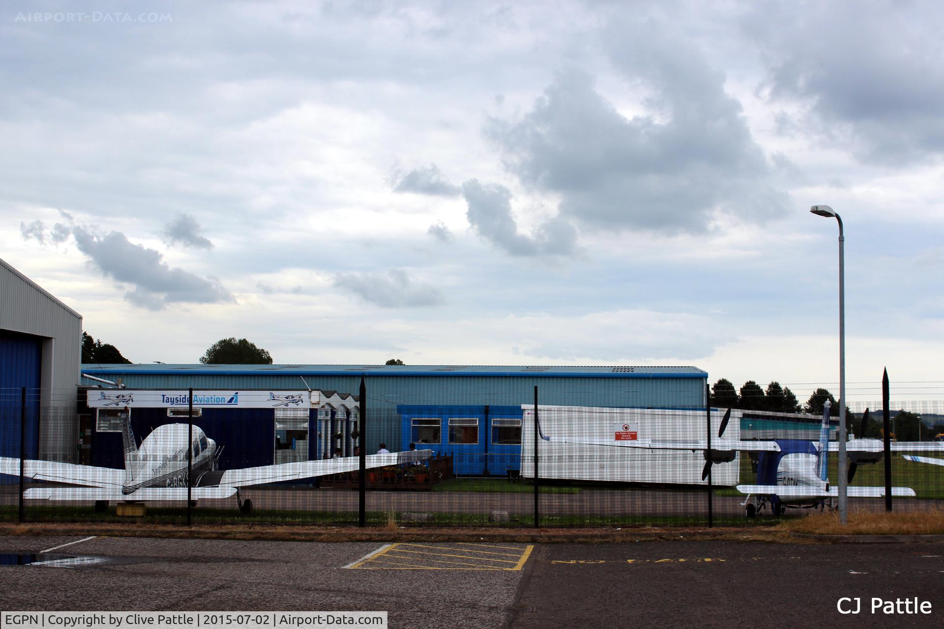 Dundee Airport, Dundee, Scotland United Kingdom (EGPN) - Through the fence glance at the Tayside Aviation HQ at Dundee Riverside Airport EGPN