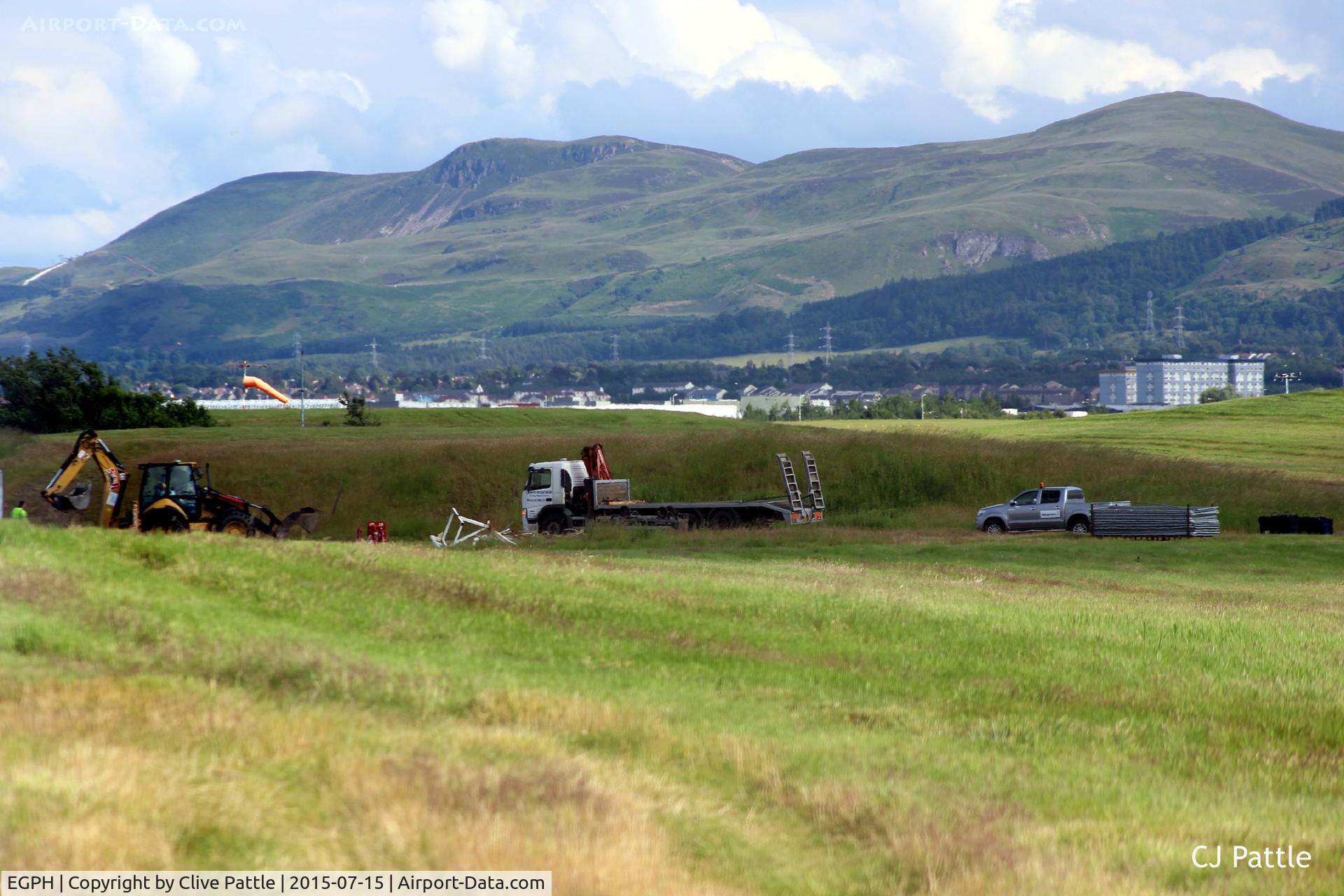 Edinburgh Airport, Edinburgh, Scotland United Kingdom (EGPH) - The final departure of Fokker F.27 TC-MBG from EGPH. The scrapmen pick up the final pieces of this wrecked aircraft that has sat on the northern side of the airport for some time.