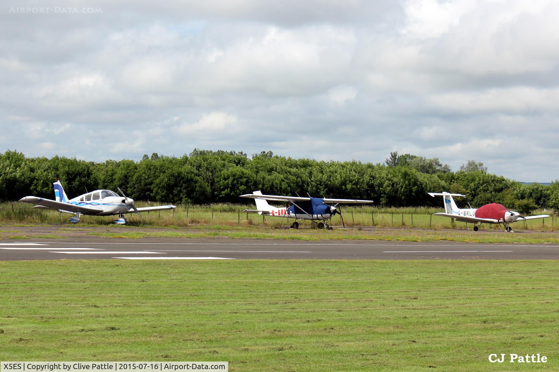 X5ES Airport - Parked GA aircraft on west side of airfield at Eshott X5ES