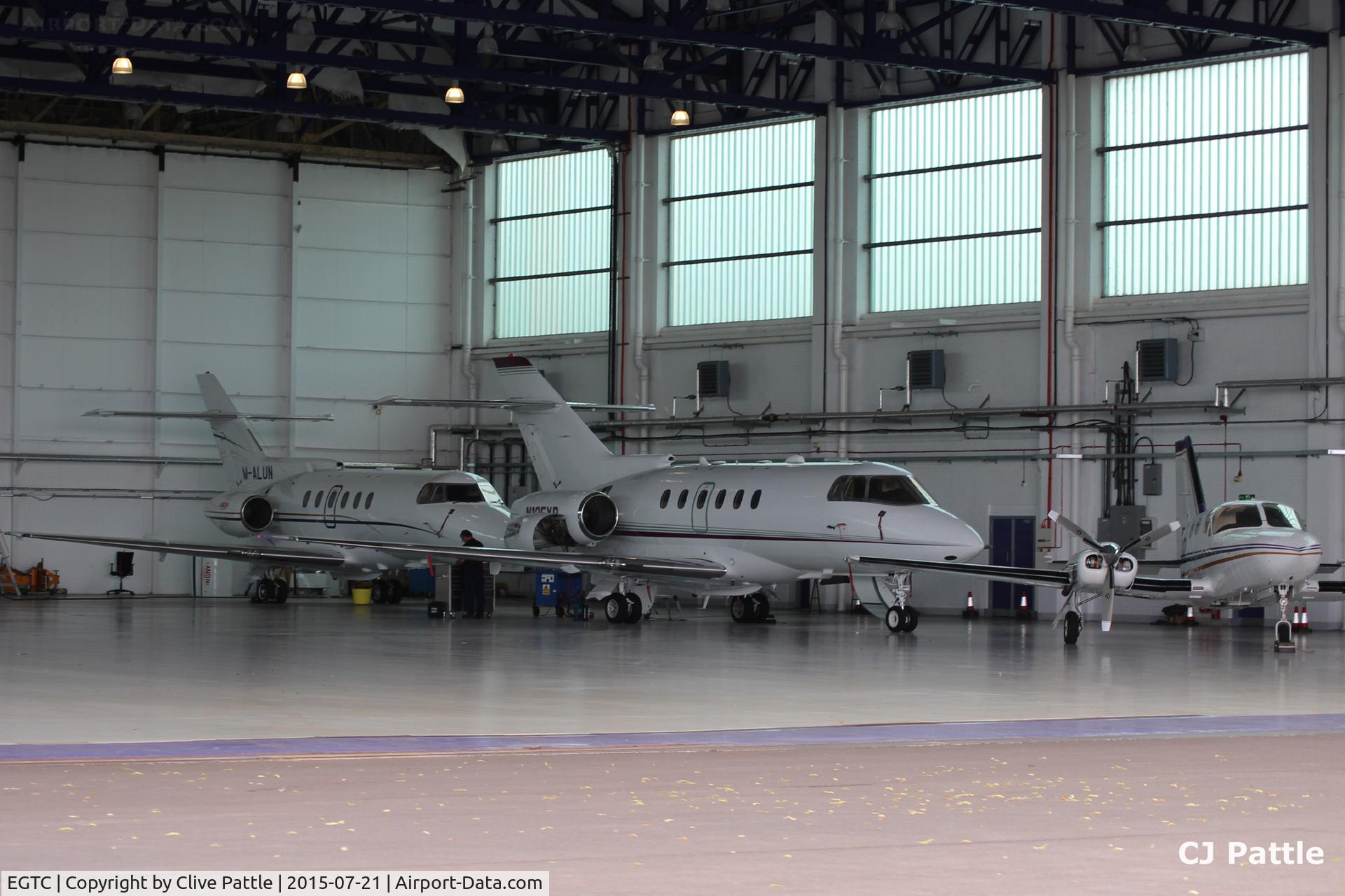 Cranfield Airport, Cranfield, England United Kingdom (EGTC) - A glimpse inside the Bizjet hangar at Cranfield EGTC, Bedfordshire, UK