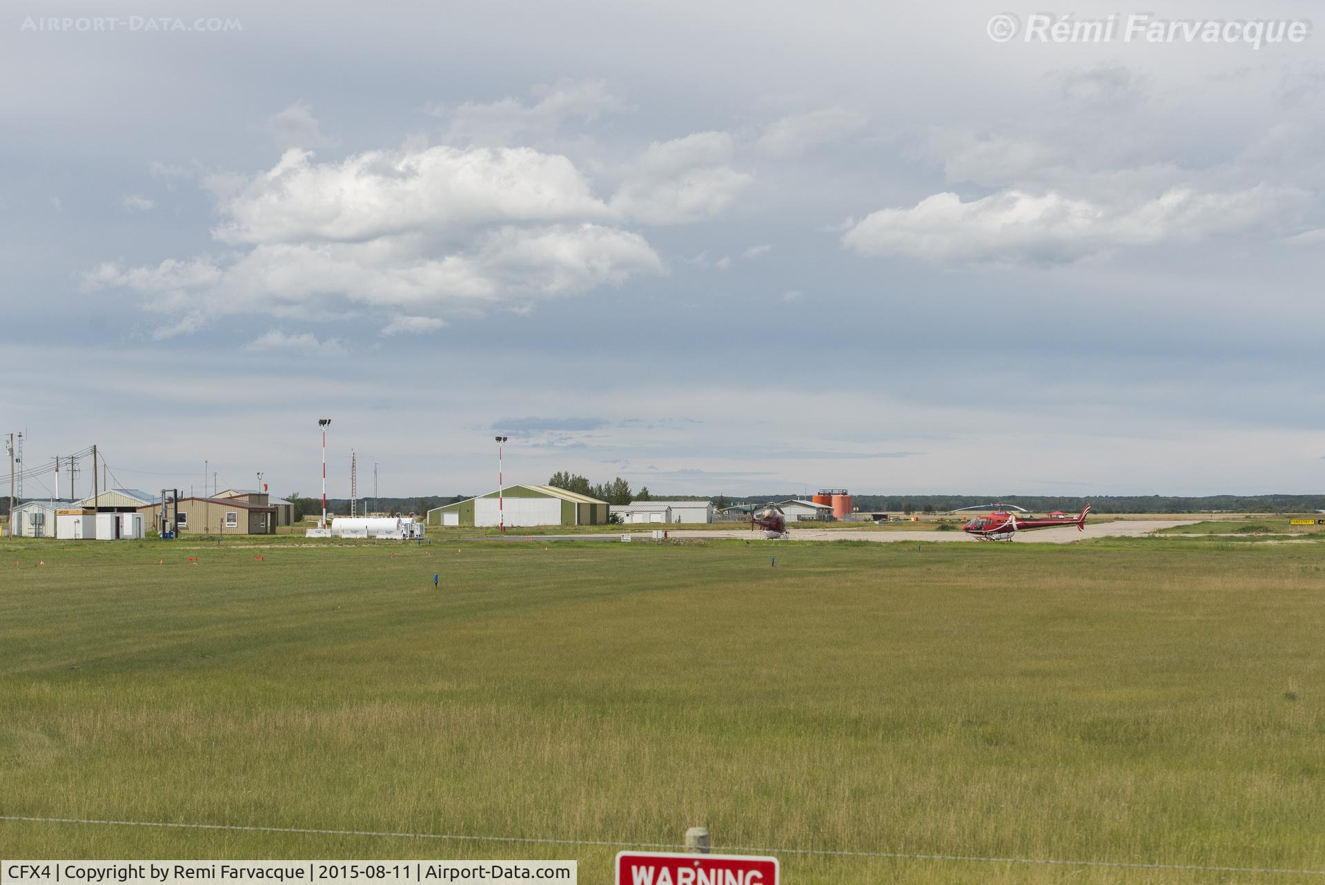 CFX4 Airport - Manning Municipal Airport, Alberta, Canada. View to west from highway of building and hangars.
