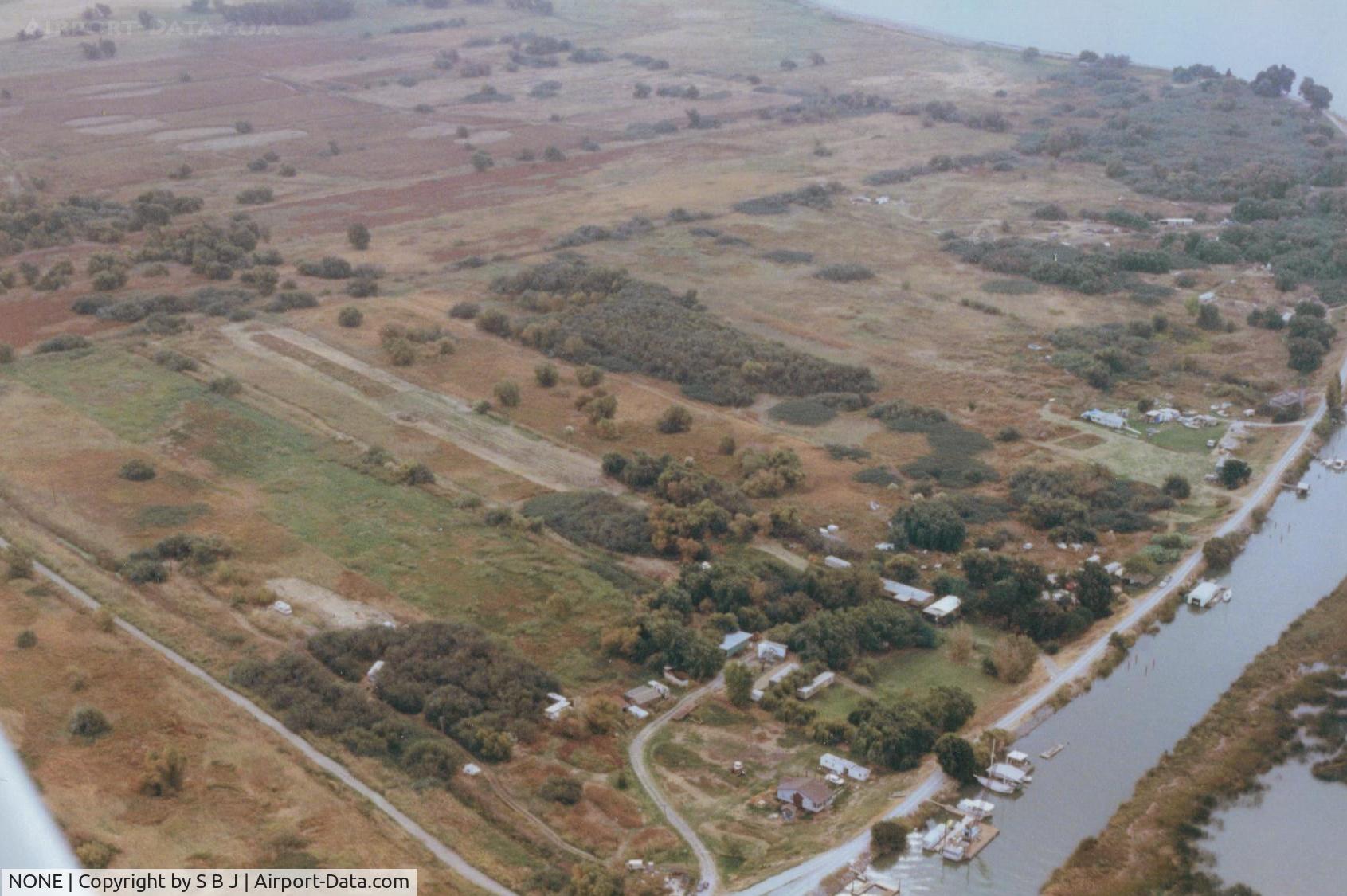 NONE Airport - Bob Ried strip in the Sacramento Delta near Rio Vista,Ca.The 1200 foot was fine for Bob in his Super Cub (N6995B) but not my Tcraft until I departed away from the trees & water but downwind.Even then it was tight with the little experience I had in 1973.